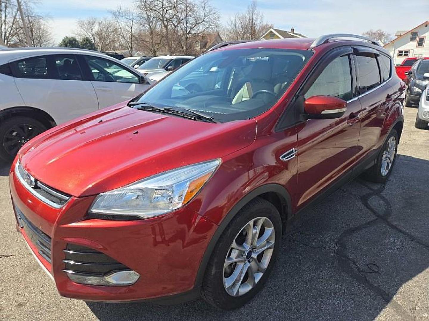 2014 ORANGE /TAN Ford Escape Titanium 4WD (1FMCU9J98EU) with an 2.0L L4 DOHC 16V engine, 6-Speed Automatic transmission, located at 3304 Woodville Road, Northwood, OH, 43619, (419) 210-8019, 41.612694, -83.480743 - Your #1 Destination for Auto Loans and mdash;No Matter Your Credit!At our dealership, we believe everyone deserves the opportunity to drive their dream car and mdash;whether you have good credit, bad credit, or no credit at all. With a wide selection of hundreds of cars, trucks, and SUVs, you'll fin - Photo#0