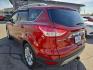 2014 ORANGE /TAN Ford Escape Titanium 4WD (1FMCU9J98EU) with an 2.0L L4 DOHC 16V engine, 6-Speed Automatic transmission, located at 3304 Woodville Road, Northwood, OH, 43619, (419) 210-8019, 41.612694, -83.480743 - Your #1 Destination for Auto Loans and mdash;No Matter Your Credit!At our dealership, we believe everyone deserves the opportunity to drive their dream car and mdash;whether you have good credit, bad credit, or no credit at all. With a wide selection of hundreds of cars, trucks, and SUVs, you'll fin - Photo#2