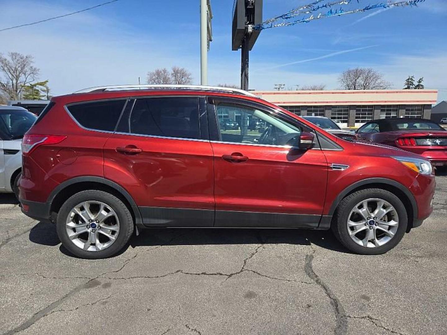 2014 ORANGE /TAN Ford Escape Titanium 4WD (1FMCU9J98EU) with an 2.0L L4 DOHC 16V engine, 6-Speed Automatic transmission, located at 3304 Woodville Road, Northwood, OH, 43619, (419) 210-8019, 41.612694, -83.480743 - Your #1 Destination for Auto Loans and mdash;No Matter Your Credit!At our dealership, we believe everyone deserves the opportunity to drive their dream car and mdash;whether you have good credit, bad credit, or no credit at all. With a wide selection of hundreds of cars, trucks, and SUVs, you'll fin - Photo#5