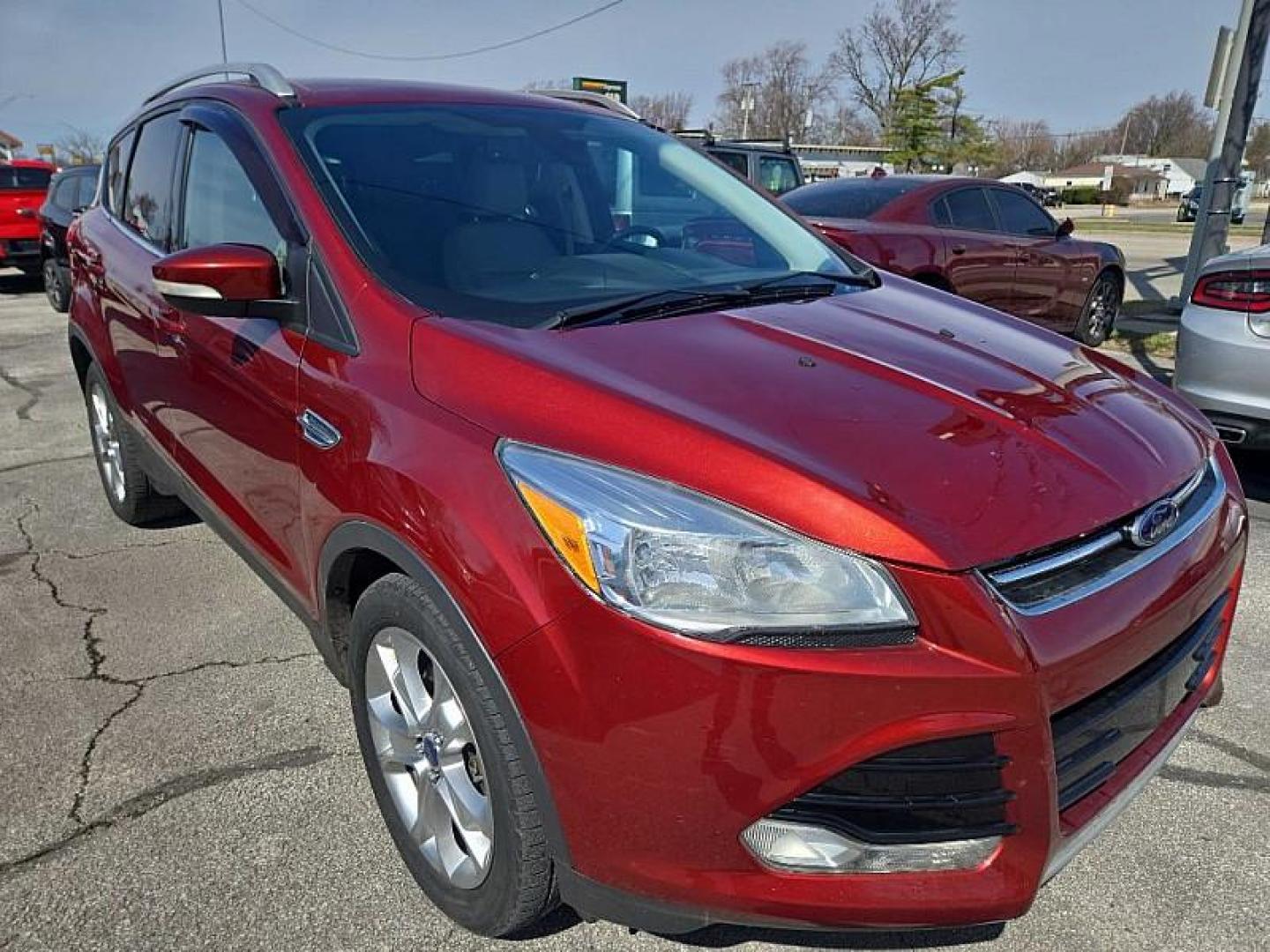 2014 ORANGE /TAN Ford Escape Titanium 4WD (1FMCU9J98EU) with an 2.0L L4 DOHC 16V engine, 6-Speed Automatic transmission, located at 3304 Woodville Road, Northwood, OH, 43619, (419) 210-8019, 41.612694, -83.480743 - Your #1 Destination for Auto Loans and mdash;No Matter Your Credit!At our dealership, we believe everyone deserves the opportunity to drive their dream car and mdash;whether you have good credit, bad credit, or no credit at all. With a wide selection of hundreds of cars, trucks, and SUVs, you'll fin - Photo#6
