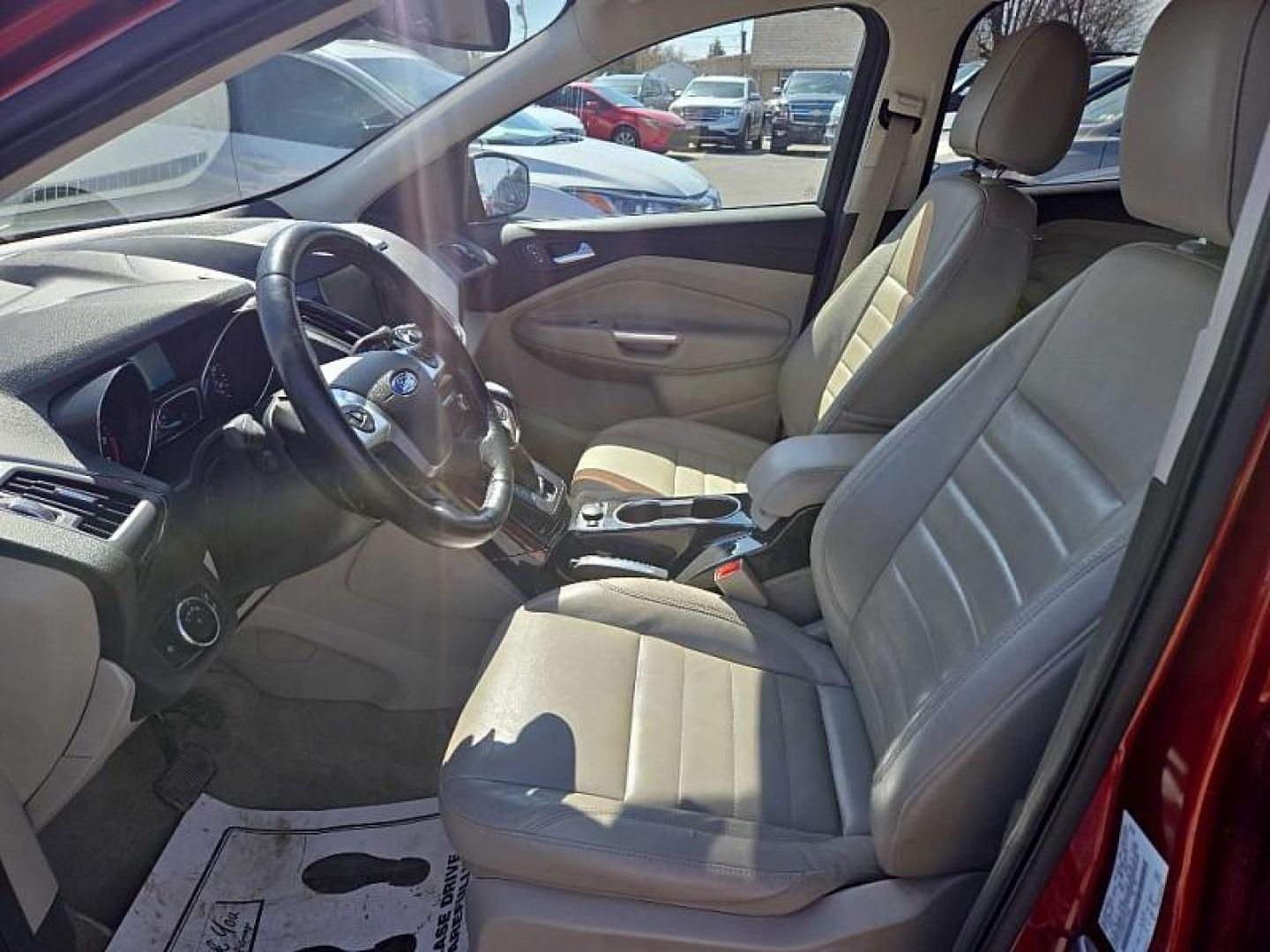 2014 ORANGE /TAN Ford Escape Titanium 4WD (1FMCU9J98EU) with an 2.0L L4 DOHC 16V engine, 6-Speed Automatic transmission, located at 3304 Woodville Road, Northwood, OH, 43619, (419) 210-8019, 41.612694, -83.480743 - Your #1 Destination for Auto Loans and mdash;No Matter Your Credit!At our dealership, we believe everyone deserves the opportunity to drive their dream car and mdash;whether you have good credit, bad credit, or no credit at all. With a wide selection of hundreds of cars, trucks, and SUVs, you'll fin - Photo#9