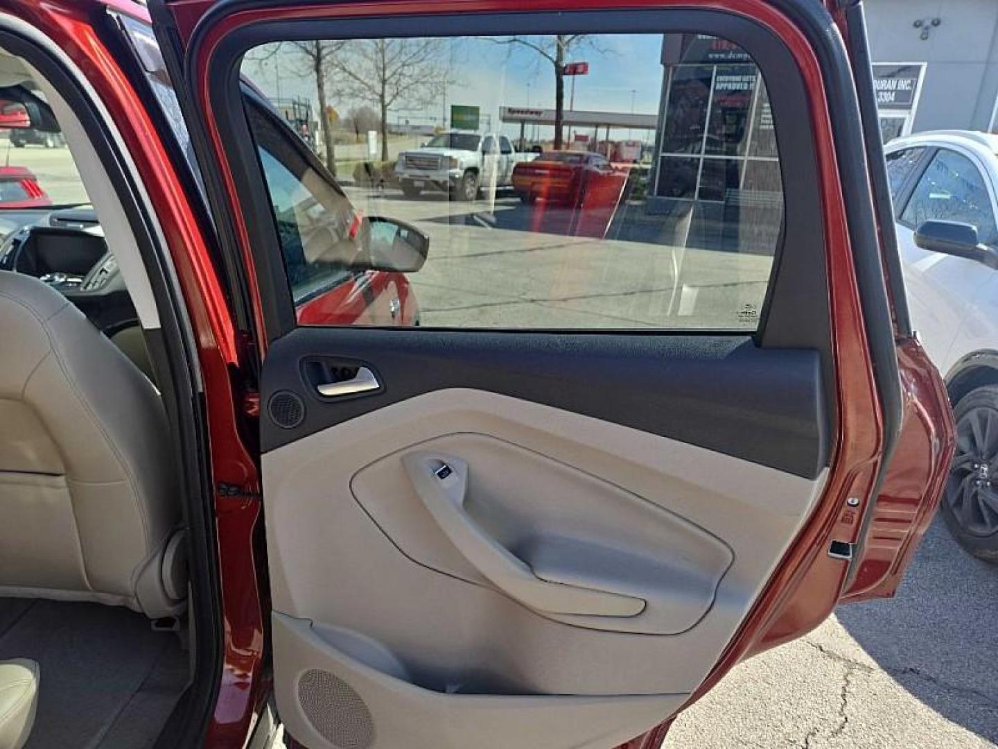 2014 ORANGE /TAN Ford Escape Titanium 4WD (1FMCU9J98EU) with an 2.0L L4 DOHC 16V engine, 6-Speed Automatic transmission, located at 3304 Woodville Road, Northwood, OH, 43619, (419) 210-8019, 41.612694, -83.480743 - Your #1 Destination for Auto Loans and mdash;No Matter Your Credit!At our dealership, we believe everyone deserves the opportunity to drive their dream car and mdash;whether you have good credit, bad credit, or no credit at all. With a wide selection of hundreds of cars, trucks, and SUVs, you'll fin - Photo#13