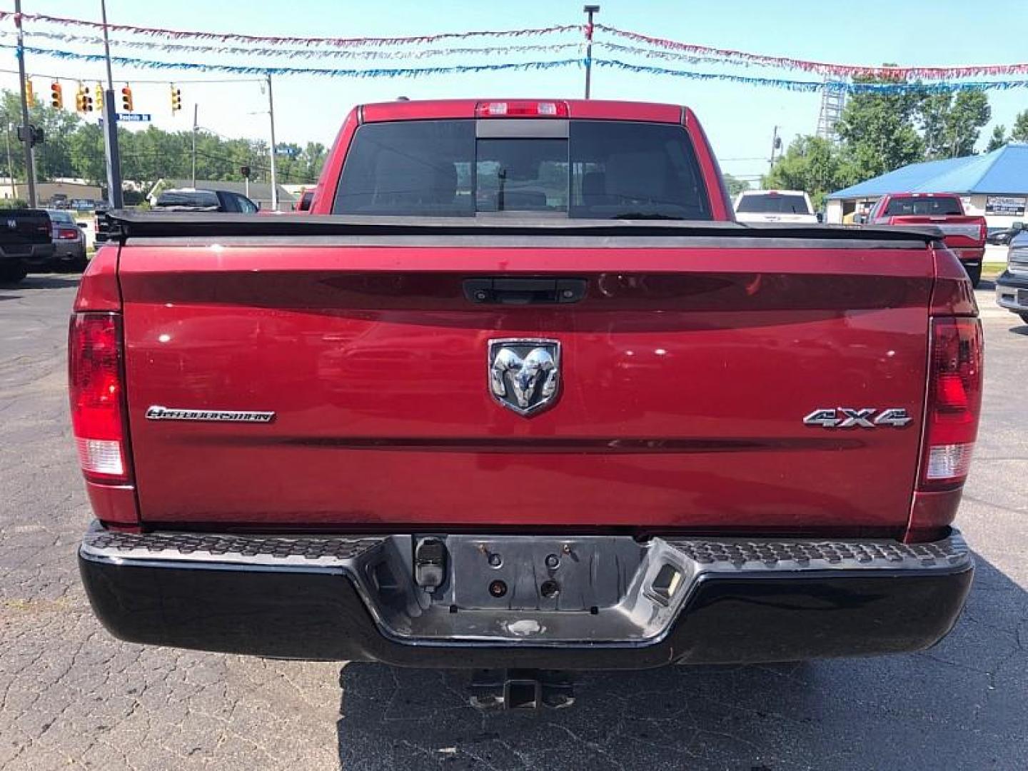 2014 RED /GRAY RAM 1500 SLT Crew Cab SWB 4WD (1C6RR7LG0ES) with an 3.6L V6 DOHC 24V FFV engine, 6-Speed Automatic transmission, located at 3304 Woodville Road, Northwood, OH, 43619, (419) 210-8019, 41.612694, -83.480743 - Your #1 Destination for Auto Loans and mdash;No Matter Your Credit!At our dealership, we believe everyone deserves the opportunity to drive their dream car and mdash;whether you have good credit, bad credit, or no credit at all. With a wide selection of hundreds of cars, trucks, and SUVs, you'll fin - Photo#3