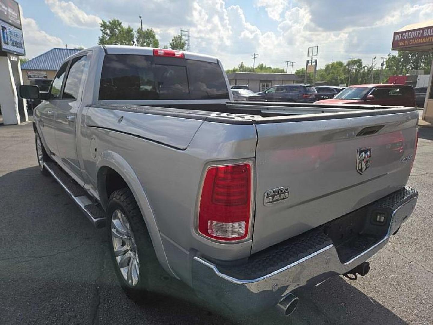 2014 SILVER /BROWN RAM 1500 Laramie Longhorn Edition Crew Cab LWB 4WD (1C6RR7WTXES) with an 5.7L V8 OHV 16V engine, 6-Speed Automatic transmission, located at 3304 Woodville Road, Northwood, OH, 43619, (419) 210-8019, 41.612694, -83.480743 - Your #1 Destination for Auto Loans and mdash;No Matter Your Credit!At our dealership, we believe everyone deserves the opportunity to drive their dream car and mdash;whether you have good credit, bad credit, or no credit at all. With a wide selection of hundreds of cars, trucks, and SUVs, you'll fin - Photo#2