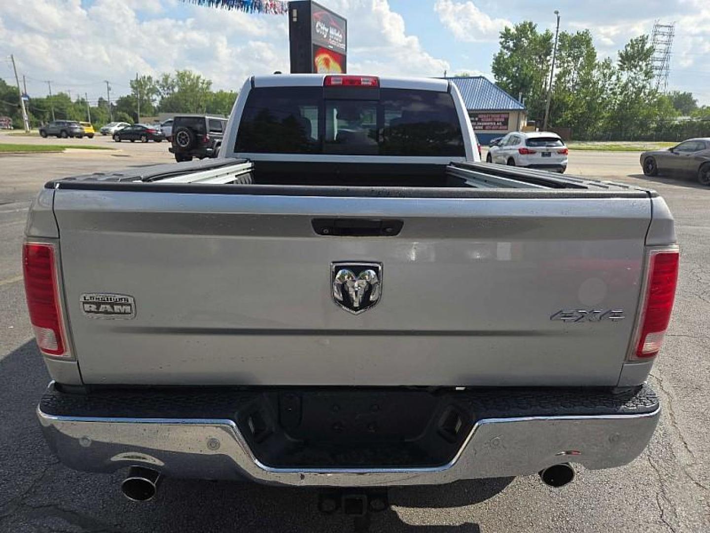 2014 SILVER /BROWN RAM 1500 Laramie Longhorn Edition Crew Cab LWB 4WD (1C6RR7WTXES) with an 5.7L V8 OHV 16V engine, 6-Speed Automatic transmission, located at 3304 Woodville Road, Northwood, OH, 43619, (419) 210-8019, 41.612694, -83.480743 - Your #1 Destination for Auto Loans and mdash;No Matter Your Credit!At our dealership, we believe everyone deserves the opportunity to drive their dream car and mdash;whether you have good credit, bad credit, or no credit at all. With a wide selection of hundreds of cars, trucks, and SUVs, you'll fin - Photo#3