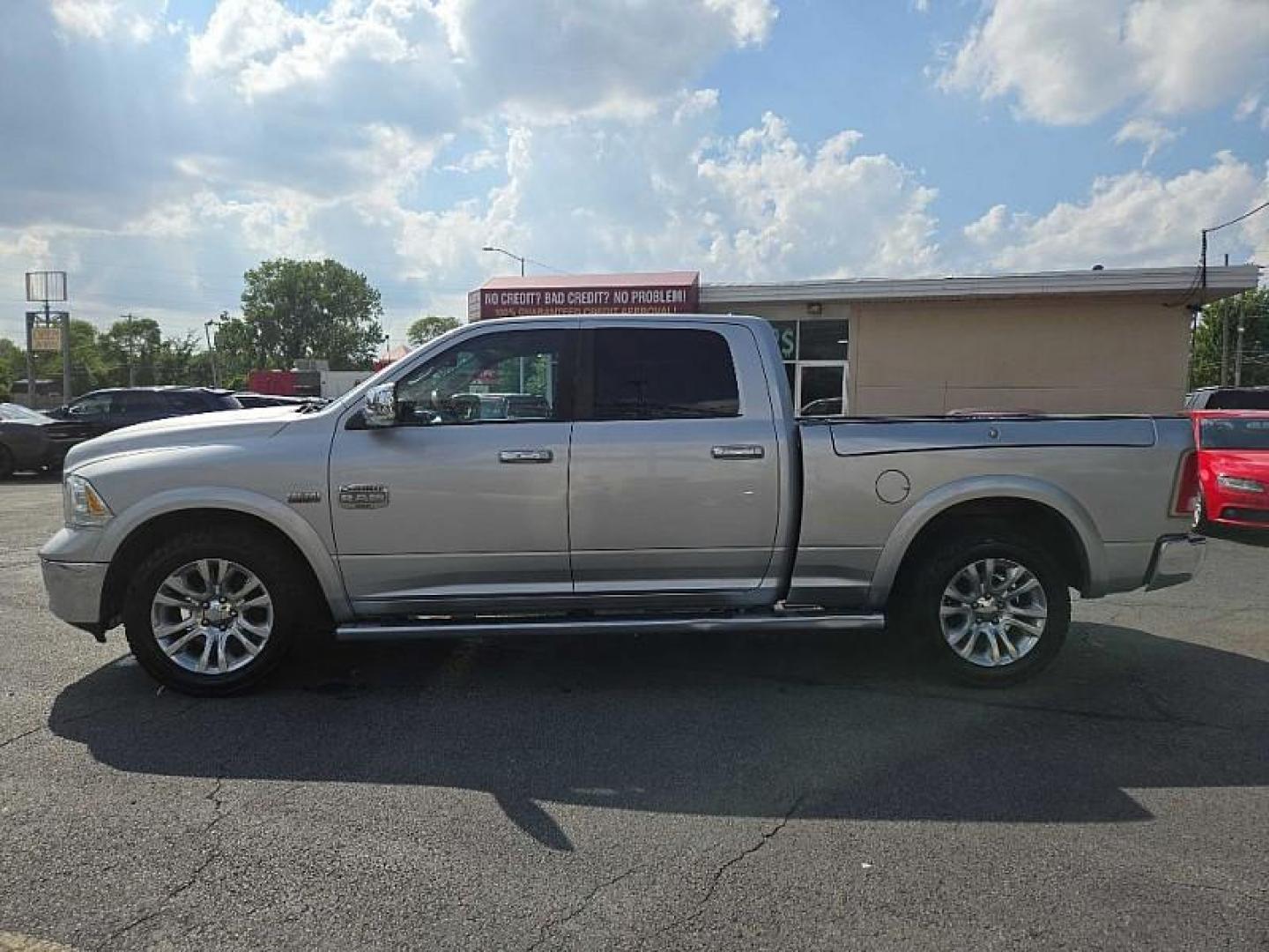 2014 SILVER /BROWN RAM 1500 Laramie Longhorn Edition Crew Cab LWB 4WD (1C6RR7WTXES) with an 5.7L V8 OHV 16V engine, 6-Speed Automatic transmission, located at 3304 Woodville Road, Northwood, OH, 43619, (419) 210-8019, 41.612694, -83.480743 - Your #1 Destination for Auto Loans and mdash;No Matter Your Credit!At our dealership, we believe everyone deserves the opportunity to drive their dream car and mdash;whether you have good credit, bad credit, or no credit at all. With a wide selection of hundreds of cars, trucks, and SUVs, you'll fin - Photo#1