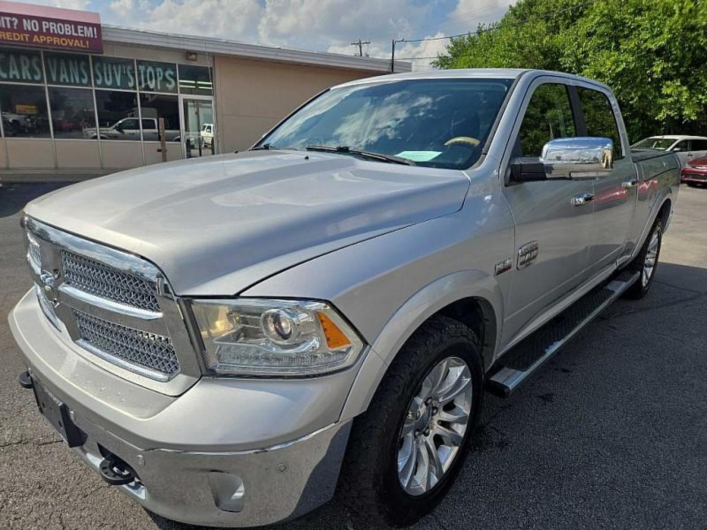 2014 SILVER /BROWN RAM 1500 Laramie Longhorn Edition Crew Cab LWB 4WD (1C6RR7WTXES) with an 5.7L V8 OHV 16V engine, 6-Speed Automatic transmission, located at 3304 Woodville Road, Northwood, OH, 43619, (419) 210-8019, 41.612694, -83.480743 - Your #1 Destination for Auto Loans and mdash;No Matter Your Credit!At our dealership, we believe everyone deserves the opportunity to drive their dream car and mdash;whether you have good credit, bad credit, or no credit at all. With a wide selection of hundreds of cars, trucks, and SUVs, you'll fin - Photo#0