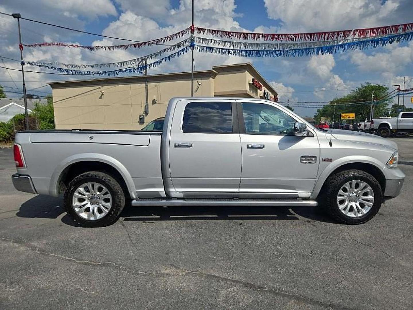 2014 SILVER /BROWN RAM 1500 Laramie Longhorn Edition Crew Cab LWB 4WD (1C6RR7WTXES) with an 5.7L V8 OHV 16V engine, 6-Speed Automatic transmission, located at 3304 Woodville Road, Northwood, OH, 43619, (419) 210-8019, 41.612694, -83.480743 - Your #1 Destination for Auto Loans and mdash;No Matter Your Credit!At our dealership, we believe everyone deserves the opportunity to drive their dream car and mdash;whether you have good credit, bad credit, or no credit at all. With a wide selection of hundreds of cars, trucks, and SUVs, you'll fin - Photo#5