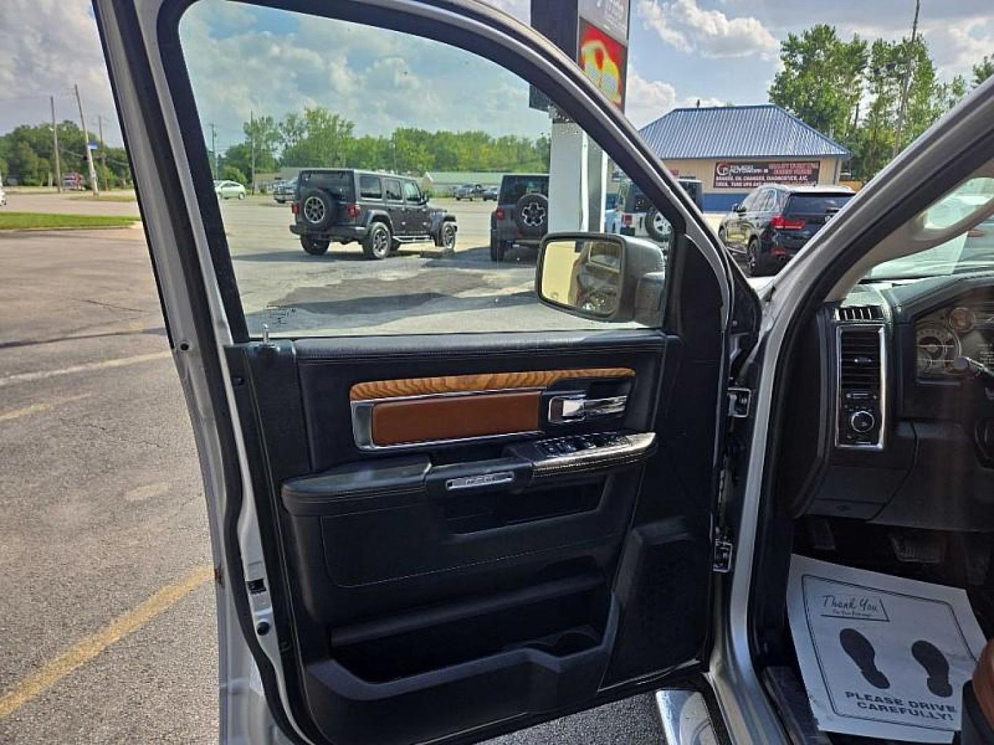 2014 SILVER /BROWN RAM 1500 Laramie Longhorn Edition Crew Cab LWB 4WD (1C6RR7WTXES) with an 5.7L V8 OHV 16V engine, 6-Speed Automatic transmission, located at 3304 Woodville Road, Northwood, OH, 43619, (419) 210-8019, 41.612694, -83.480743 - Your #1 Destination for Auto Loans and mdash;No Matter Your Credit!At our dealership, we believe everyone deserves the opportunity to drive their dream car and mdash;whether you have good credit, bad credit, or no credit at all. With a wide selection of hundreds of cars, trucks, and SUVs, you'll fin - Photo#8