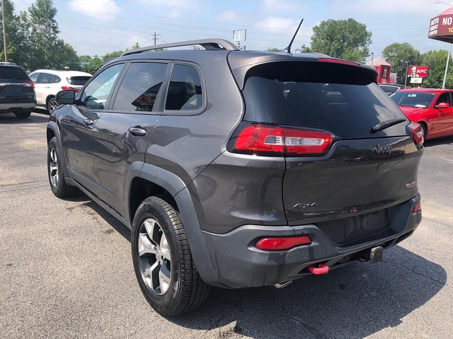 2015 GRAY /BLACK Jeep Cherokee Trailhawk 4WD (1C4PJMBS1FW) with an 3.2L V6 DOHC 24V engine, 9-Speed Automatic transmission, located at 3304 Woodville Road, Northwood, OH, 43619, (419) 210-8019, 41.612694, -83.480743 - Your #1 Destination for Auto Loans and mdash;No Matter Your Credit!At our dealership, we believe everyone deserves the opportunity to drive their dream car and mdash;whether you have good credit, bad credit, or no credit at all. With a wide selection of hundreds of cars, trucks, and SUVs, you'll fin - Photo#2