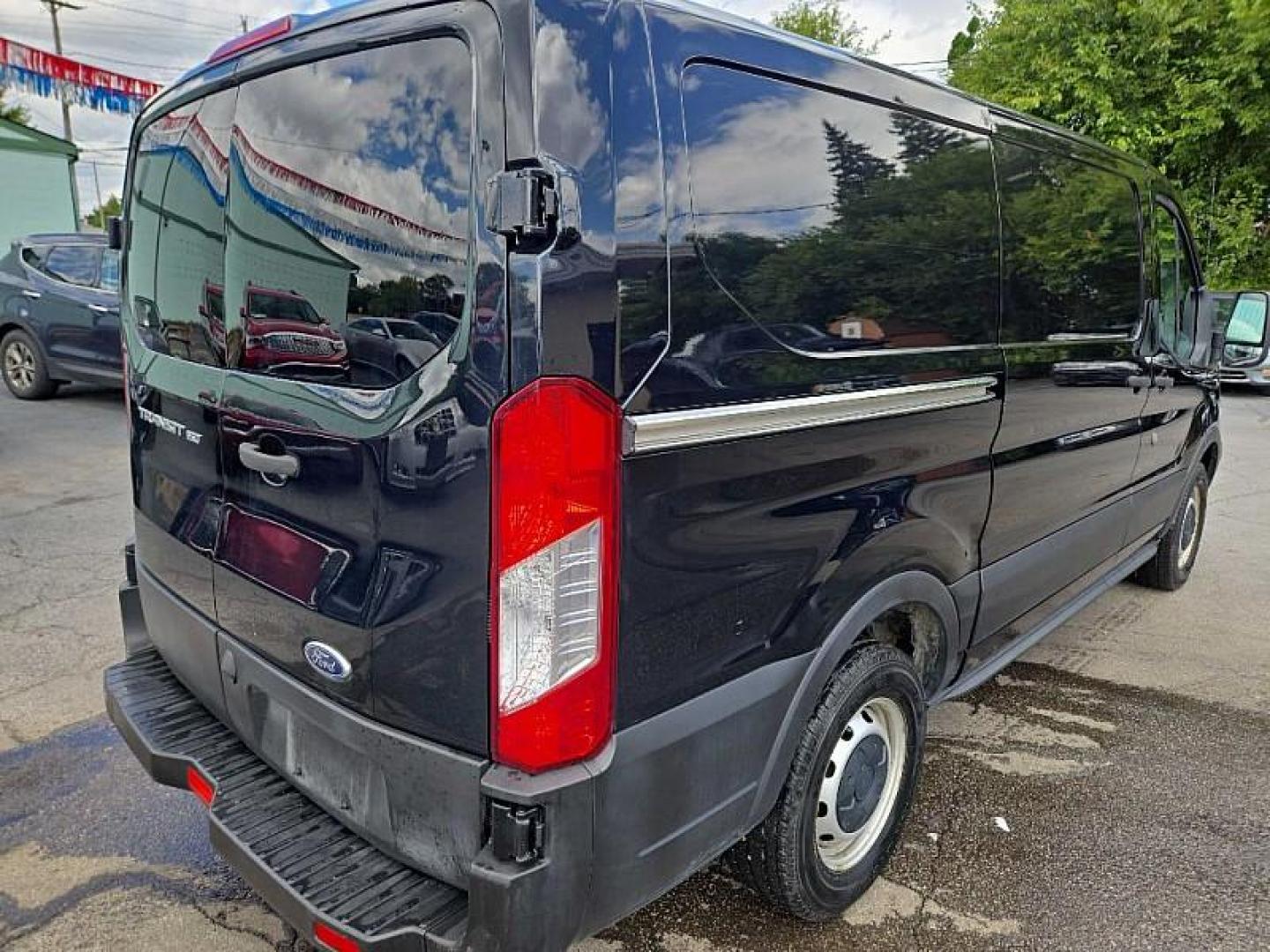 2019 BLACK /GRAY Ford Transit 150 Van Low Roof w/Sliding Pass. 130-in. WB (1FTYE1YM0KK) with an 3.7L V6 DOHC 24V engine, 6A transmission, located at 3304 Woodville Road, Northwood, OH, 43619, (419) 210-8019, 41.612694, -83.480743 - Your #1 Destination for Auto Loans and mdash;No Matter Your Credit!At our dealership, we believe everyone deserves the opportunity to drive their dream car and mdash;whether you have good credit, bad credit, or no credit at all. With a wide selection of hundreds of cars, trucks, and SUVs, you'll fin - Photo#4