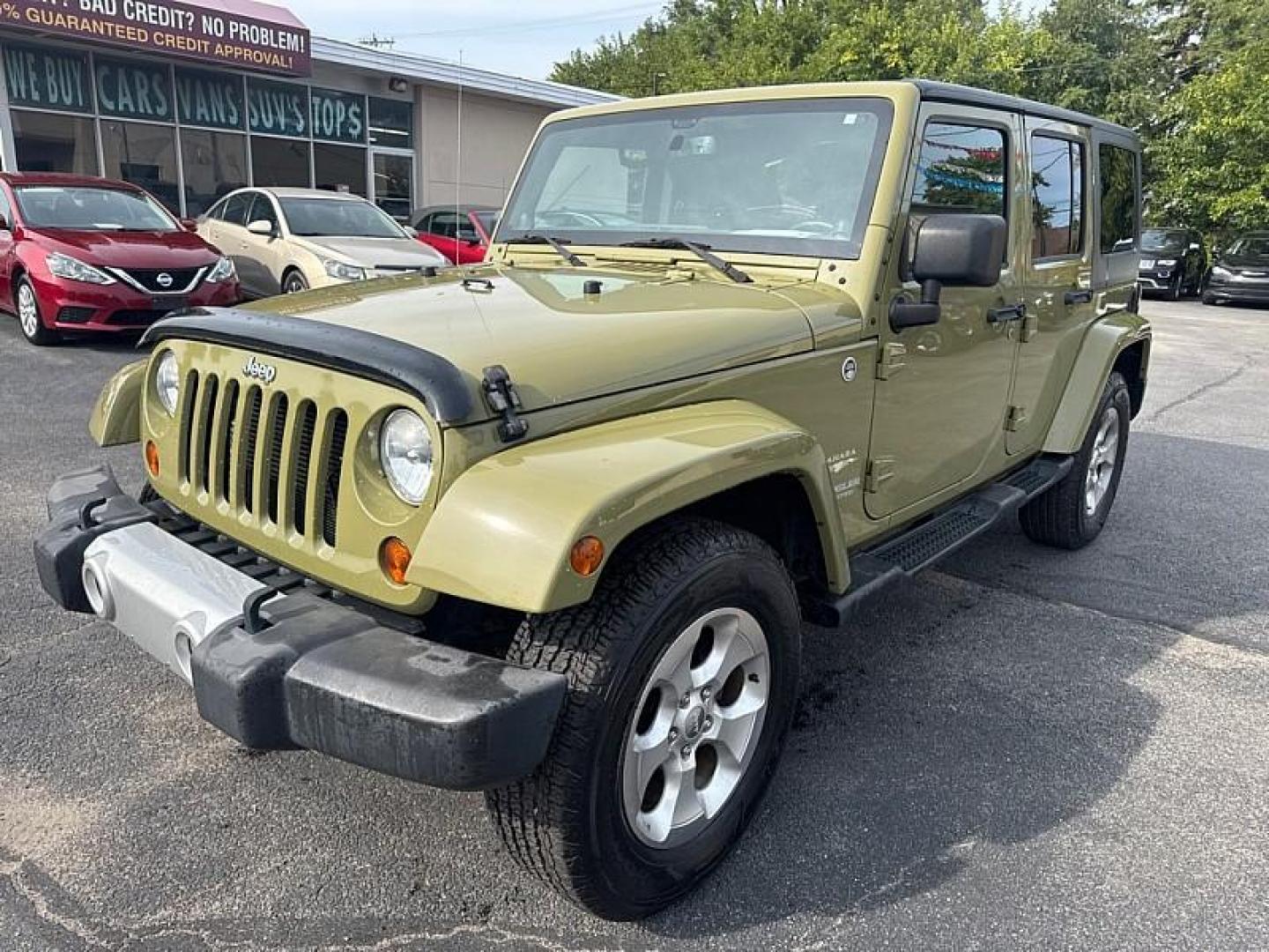 2013 GREEN /BLACK Jeep Wrangler Unlimited Sahara 4WD (1C4BJWEG0DL) with an 3.6L V6 DOHC 24V FFV engine, Automatic 5-Spd transmission, located at 3304 Woodville Road, Northwood, OH, 43619, (419) 210-8019, 41.612694, -83.480743 - Your #1 Destination for Auto Loans and mdash;No Matter Your Credit!At our dealership, we believe everyone deserves the opportunity to drive their dream car and mdash;whether you have good credit, bad credit, or no credit at all. With a wide selection of hundreds of cars, trucks, and SUVs, you'll fin - Photo#0