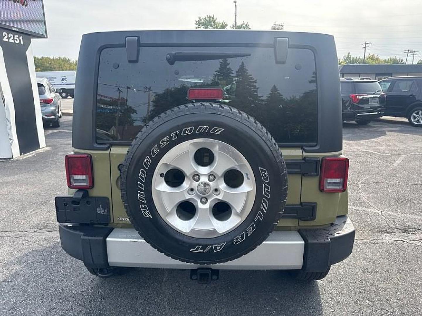 2013 GREEN /BLACK Jeep Wrangler Unlimited Sahara 4WD (1C4BJWEG0DL) with an 3.6L V6 DOHC 24V FFV engine, Automatic 5-Spd transmission, located at 3304 Woodville Road, Northwood, OH, 43619, (419) 210-8019, 41.612694, -83.480743 - Your #1 Destination for Auto Loans and mdash;No Matter Your Credit!At our dealership, we believe everyone deserves the opportunity to drive their dream car and mdash;whether you have good credit, bad credit, or no credit at all. With a wide selection of hundreds of cars, trucks, and SUVs, you'll fin - Photo#3