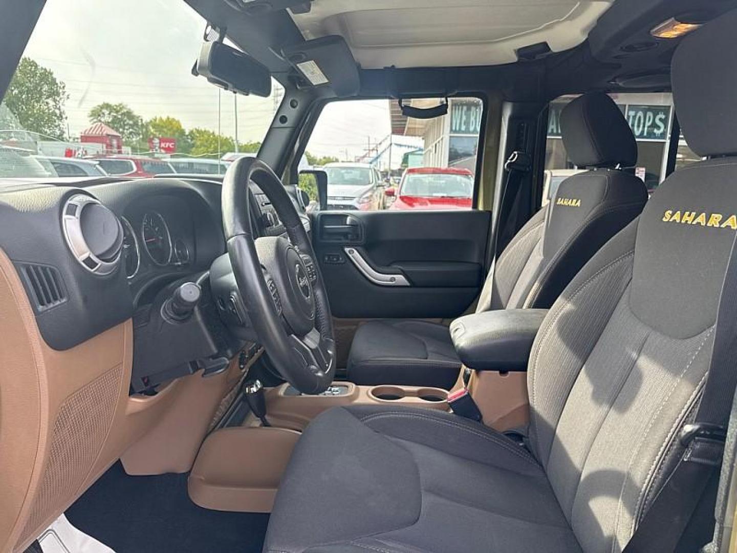 2013 GREEN /BLACK Jeep Wrangler Unlimited Sahara 4WD (1C4BJWEG0DL) with an 3.6L V6 DOHC 24V FFV engine, Automatic 5-Spd transmission, located at 3304 Woodville Road, Northwood, OH, 43619, (419) 210-8019, 41.612694, -83.480743 - Your #1 Destination for Auto Loans and mdash;No Matter Your Credit!At our dealership, we believe everyone deserves the opportunity to drive their dream car and mdash;whether you have good credit, bad credit, or no credit at all. With a wide selection of hundreds of cars, trucks, and SUVs, you'll fin - Photo#9