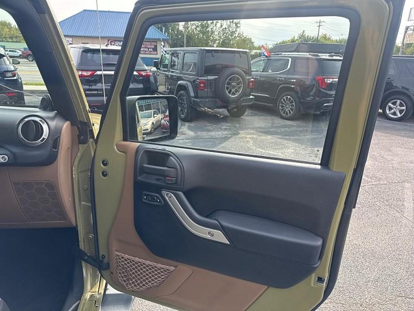 2013 GREEN /BLACK Jeep Wrangler Unlimited Sahara 4WD (1C4BJWEG0DL) with an 3.6L V6 DOHC 24V FFV engine, Automatic 5-Spd transmission, located at 3304 Woodville Road, Northwood, OH, 43619, (419) 210-8019, 41.612694, -83.480743 - Your #1 Destination for Auto Loans and mdash;No Matter Your Credit!At our dealership, we believe everyone deserves the opportunity to drive their dream car and mdash;whether you have good credit, bad credit, or no credit at all. With a wide selection of hundreds of cars, trucks, and SUVs, you'll fin - Photo#15
