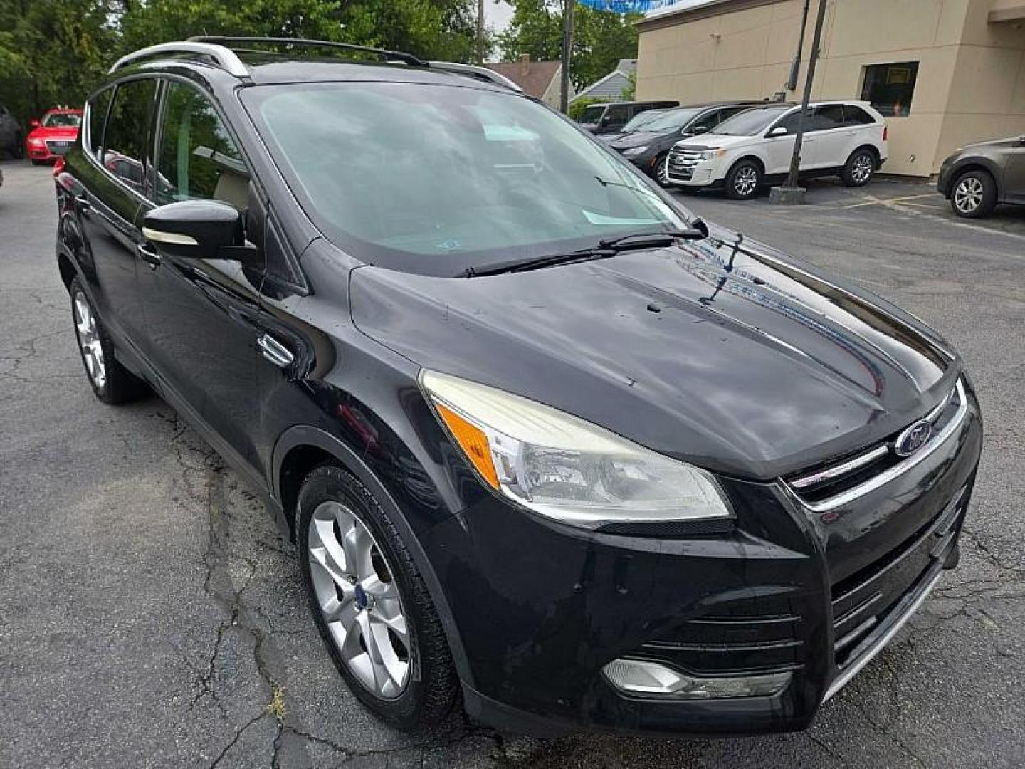 2014 BLACK /BLACK Ford Escape Titanium FWD (1FMCU0J9XEU) with an 2.0L L4 DOHC 16V engine, 6-Speed Automatic transmission, located at 3304 Woodville Road, Northwood, OH, 43619, (419) 210-8019, 41.612694, -83.480743 - Photo#6