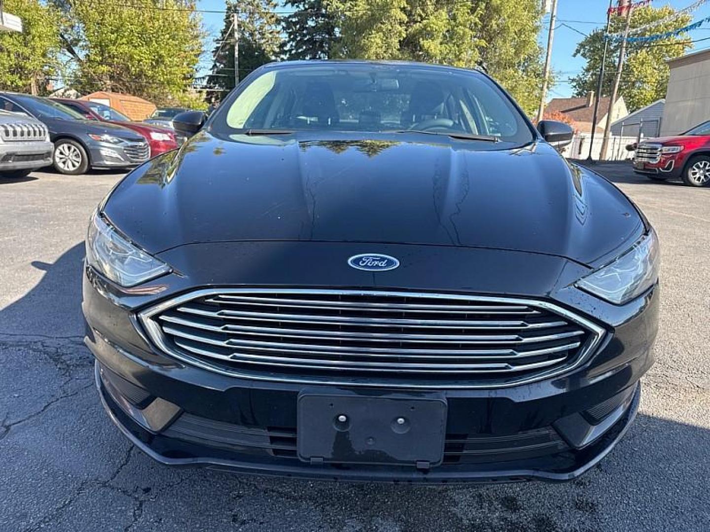 2018 BLACK /BLACK Ford Fusion SE (3FA6P0H75JR) with an 2.5L L4 DOHC 16V engine, 6A transmission, located at 3304 Woodville Road, Northwood, OH, 43619, (419) 210-8019, 41.612694, -83.480743 - Photo#7
