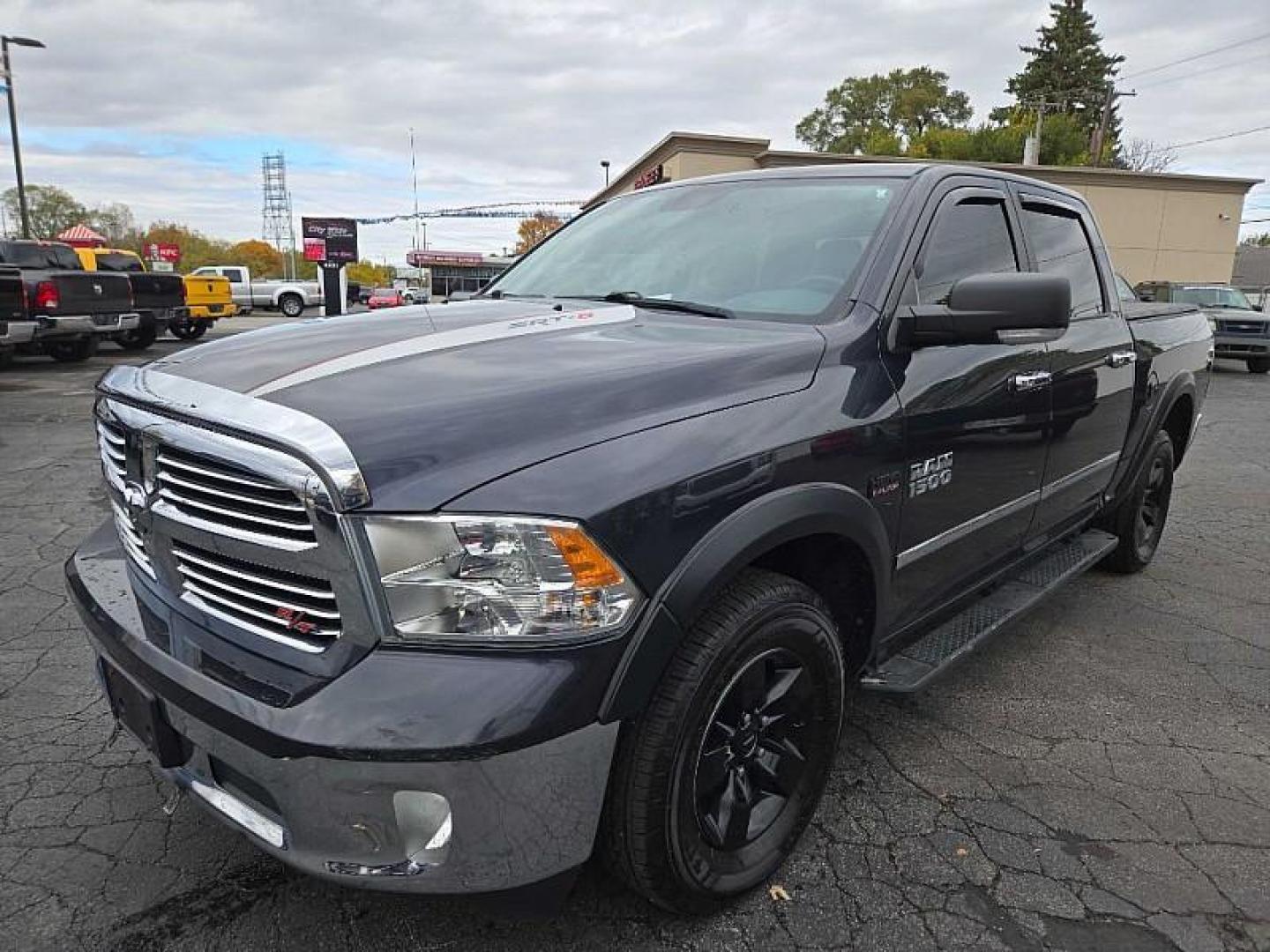 2016 GRAY /BLACK RAM 1500 SLT Crew Cab SWB 4WD (1C6RR7LT0GS) with an 5.7L V8 OHV 16V engine, 6A transmission, located at 3304 Woodville Road, Northwood, OH, 43619, (419) 210-8019, 41.612694, -83.480743 - Your #1 Destination for Auto Loans and mdash;No Matter Your Credit!At our dealership, we believe everyone deserves the opportunity to drive their dream car and mdash;whether you have good credit, bad credit, or no credit at all. With a wide selection of hundreds of cars, trucks, and SUVs, you'll fin - Photo#0