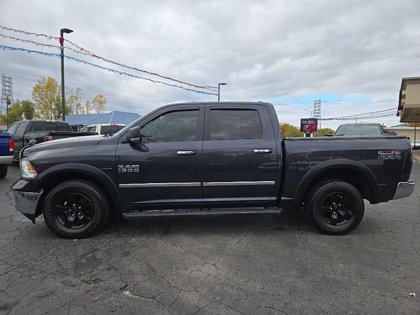 2016 GRAY /BLACK RAM 1500 SLT Crew Cab SWB 4WD (1C6RR7LT0GS) with an 5.7L V8 OHV 16V engine, 6A transmission, located at 3304 Woodville Road, Northwood, OH, 43619, (419) 210-8019, 41.612694, -83.480743 - Your #1 Destination for Auto Loans and mdash;No Matter Your Credit!At our dealership, we believe everyone deserves the opportunity to drive their dream car and mdash;whether you have good credit, bad credit, or no credit at all. With a wide selection of hundreds of cars, trucks, and SUVs, you'll fin - Photo#1