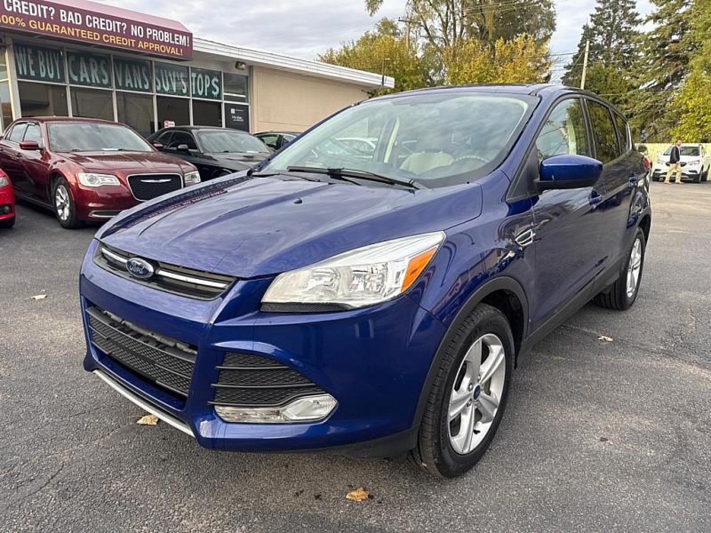 2016 BLUE /GRAY Ford Escape SE 4WD (1FMCU9GX0GU) with an 1.6L L4 DOHC 16V engine, 6-Speed Automatic transmission, located at 3304 Woodville Road, Northwood, OH, 43619, (419) 210-8019, 41.612694, -83.480743 - Your #1 Destination for Auto Loans and mdash;No Matter Your Credit!At our dealership, we believe everyone deserves the opportunity to drive their dream car and mdash;whether you have good credit, bad credit, or no credit at all. With a wide selection of hundreds of cars, trucks, and SUVs, you'll fin - Photo#0