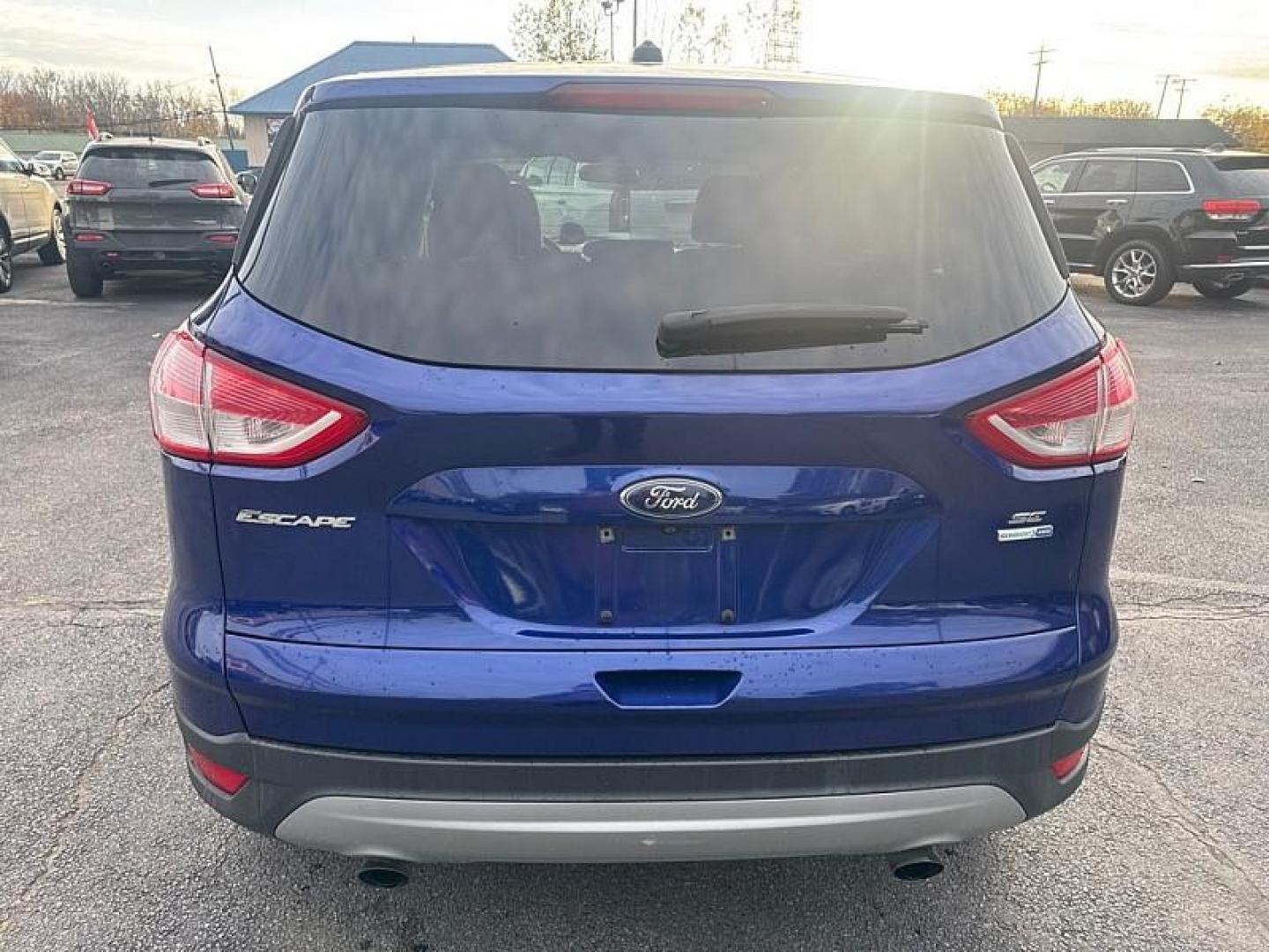2016 BLUE /GRAY Ford Escape SE 4WD (1FMCU9GX0GU) with an 1.6L L4 DOHC 16V engine, 6-Speed Automatic transmission, located at 3304 Woodville Road, Northwood, OH, 43619, (419) 210-8019, 41.612694, -83.480743 - Your #1 Destination for Auto Loans and mdash;No Matter Your Credit!At our dealership, we believe everyone deserves the opportunity to drive their dream car and mdash;whether you have good credit, bad credit, or no credit at all. With a wide selection of hundreds of cars, trucks, and SUVs, you'll fin - Photo#3