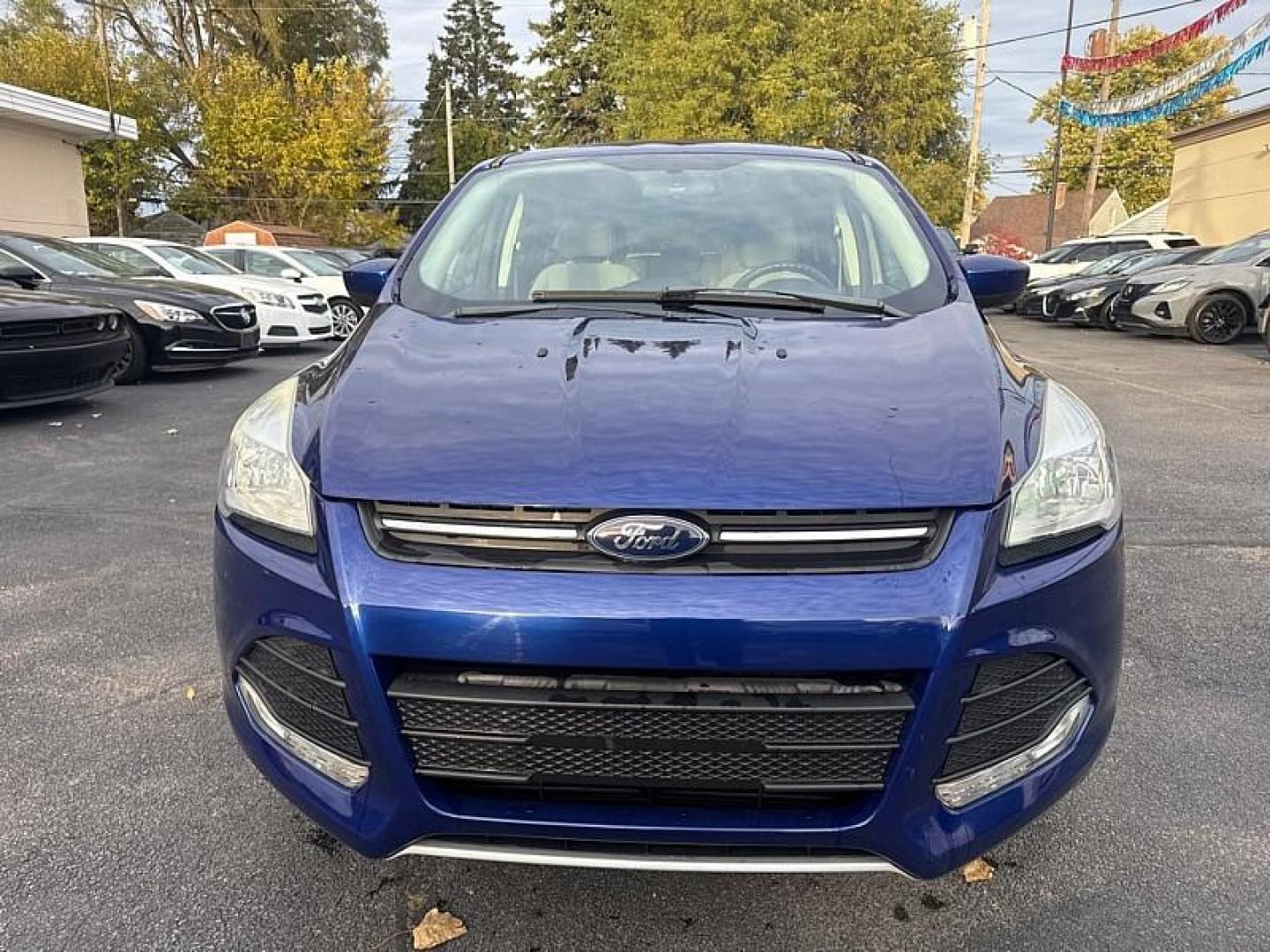 2016 BLUE /GRAY Ford Escape SE 4WD (1FMCU9GX0GU) with an 1.6L L4 DOHC 16V engine, 6-Speed Automatic transmission, located at 3304 Woodville Road, Northwood, OH, 43619, (419) 210-8019, 41.612694, -83.480743 - Your #1 Destination for Auto Loans and mdash;No Matter Your Credit!At our dealership, we believe everyone deserves the opportunity to drive their dream car and mdash;whether you have good credit, bad credit, or no credit at all. With a wide selection of hundreds of cars, trucks, and SUVs, you'll fin - Photo#7