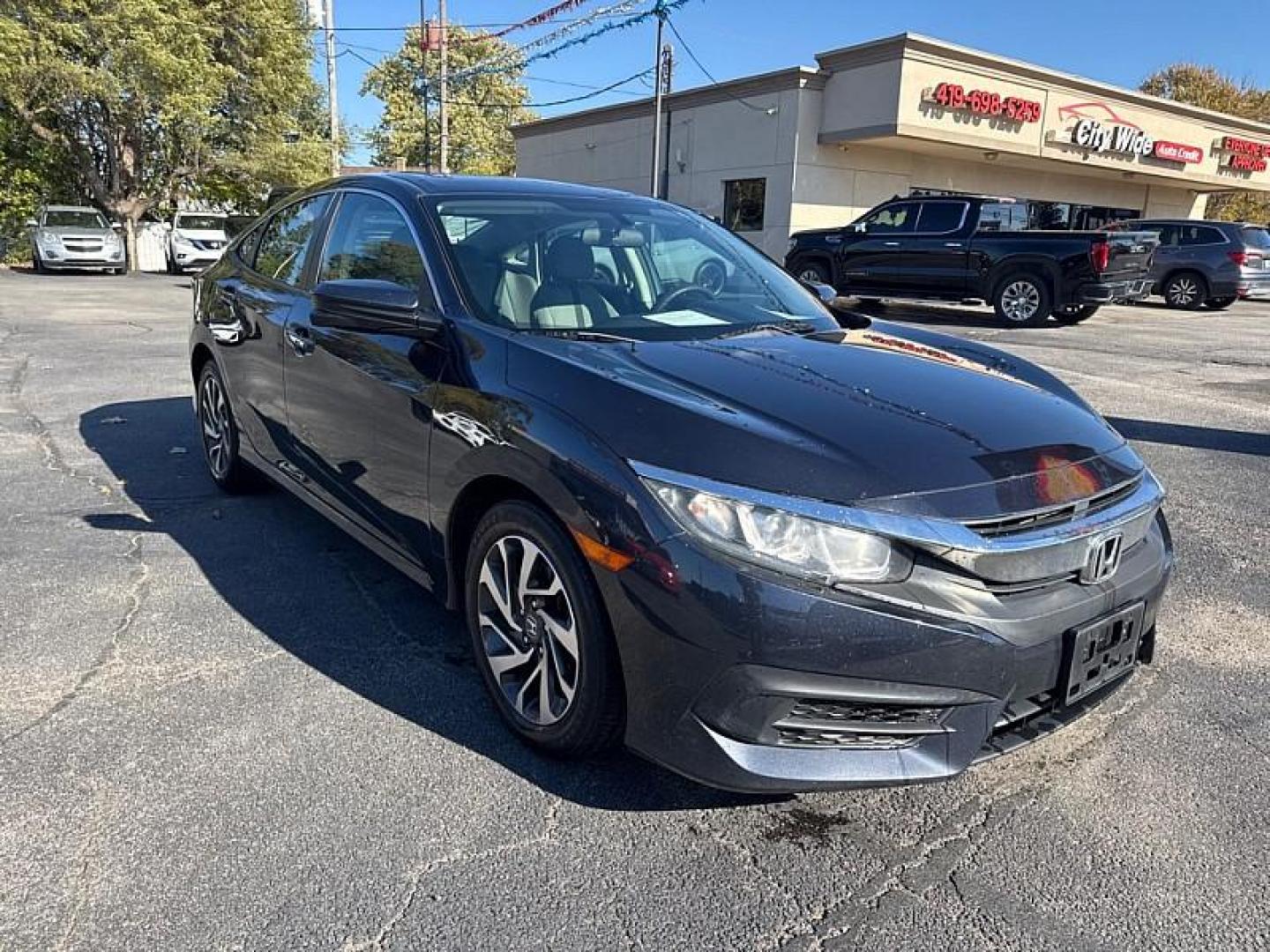 2018 GRAY /BLACK Honda Civic EX Sedan CVT (2HGFC2F71JH) with an 2.0L L4 DOHC 16V engine, CVT transmission, located at 3304 Woodville Road, Northwood, OH, 43619, (419) 210-8019, 41.612694, -83.480743 - Your #1 Destination for Auto Loans and mdash;No Matter Your Credit!At our dealership, we believe everyone deserves the opportunity to drive their dream car and mdash;whether you have good credit, bad credit, or no credit at all. With a wide selection of hundreds of cars, trucks, and SUVs, you'll fin - Photo#6