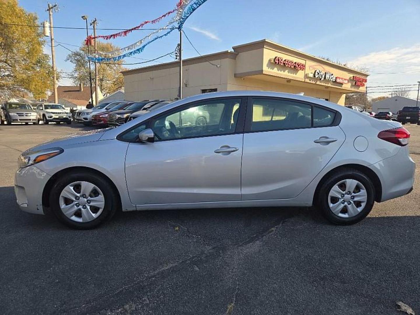 2017 BLUE /BLACK Kia Forte LX 6A (3KPFL4A79HE) with an 2.0L L4 DOHC 16V engine, 6A transmission, located at 3304 Woodville Road, Northwood, OH, 43619, (419) 210-8019, 41.612694, -83.480743 - Photo#1