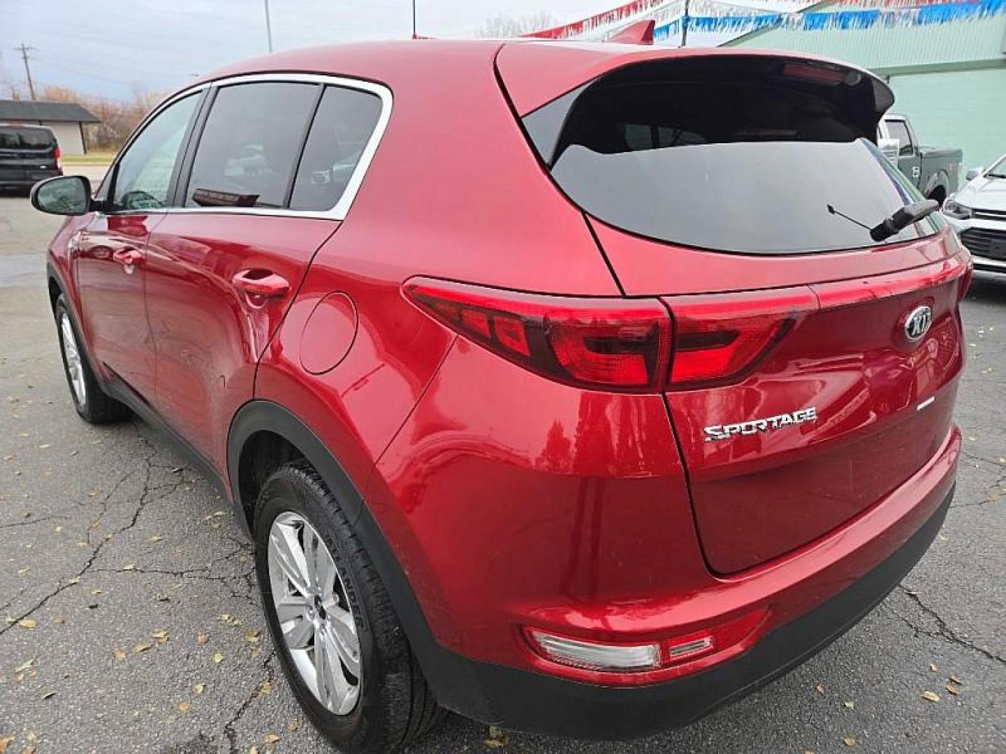 2019 RED /BLACK Kia Sportage LX AWD (KNDPMCAC8K7) with an 2.4L V6 DOHC 24V engine, 6A transmission, located at 3304 Woodville Road, Northwood, OH, 43619, (419) 210-8019, 41.612694, -83.480743 - Your #1 Destination for Auto Loans and mdash;No Matter Your Credit!At our dealership, we believe everyone deserves the opportunity to drive their dream car and mdash;whether you have good credit, bad credit, or no credit at all. With a wide selection of hundreds of cars, trucks, and SUVs, you'll fin - Photo#2