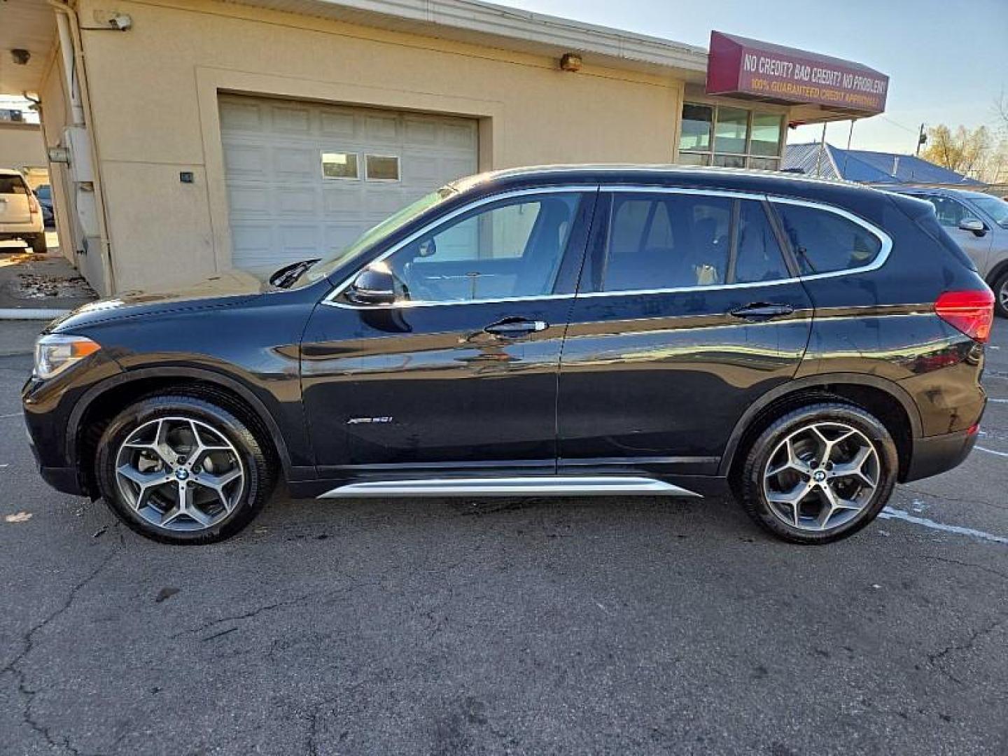 2018 BLACK /BLACK BMW X1 xDrive28i (WBXHT3C36J5) with an 2.0L L4 DOHC 16V engine, 8A transmission, located at 3304 Woodville Road, Northwood, OH, 43619, (419) 210-8019, 41.612694, -83.480743 - Your #1 Destination for Auto Loans and mdash;No Matter Your Credit!At our dealership, we believe everyone deserves the opportunity to drive their dream car and mdash;whether you have good credit, bad credit, or no credit at all. With a wide selection of hundreds of cars, trucks, and SUVs, you'll fin - Photo#1