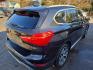 2018 BLACK /BLACK BMW X1 xDrive28i (WBXHT3C36J5) with an 2.0L L4 DOHC 16V engine, 8A transmission, located at 3304 Woodville Road, Northwood, OH, 43619, (419) 210-8019, 41.612694, -83.480743 - Your #1 Destination for Auto Loans and mdash;No Matter Your Credit!At our dealership, we believe everyone deserves the opportunity to drive their dream car and mdash;whether you have good credit, bad credit, or no credit at all. With a wide selection of hundreds of cars, trucks, and SUVs, you'll fin - Photo#4