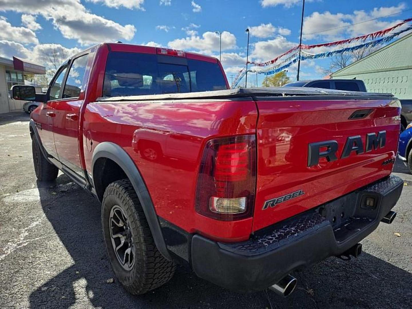 2015 RED /BLACK and RED RAM 1500 Rebel Crew Cab SWB 4WD (1C6RR7YTXFS) with an 5.7L V8 OHV 16V engine, 6A transmission, located at 3304 Woodville Road, Northwood, OH, 43619, (419) 210-8019, 41.612694, -83.480743 - Your #1 Destination for Auto Loans and mdash;No Matter Your Credit!At our dealership, we believe everyone deserves the opportunity to drive their dream car and mdash;whether you have good credit, bad credit, or no credit at all. With a wide selection of hundreds of cars, trucks, and SUVs, you'll fin - Photo#2