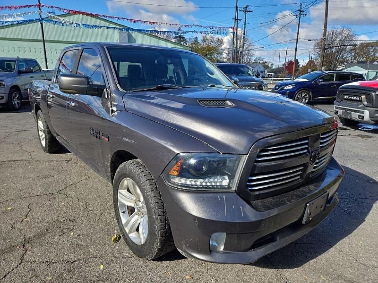 2015 GRAY /BLACK RAM 1500 Sport Crew Cab SWB 4WD (1C6RR7MT3FS) with an 5.7L V8 OHV 16V engine, 6-Speed Automatic transmission, located at 3304 Woodville Road, Northwood, OH, 43619, (419) 210-8019, 41.612694, -83.480743 - Your #1 Destination for Auto Loans and mdash;No Matter Your Credit!At our dealership, we believe everyone deserves the opportunity to drive their dream car and mdash;whether you have good credit, bad credit, or no credit at all. With a wide selection of hundreds of cars, trucks, and SUVs, you'll fin - Photo#6