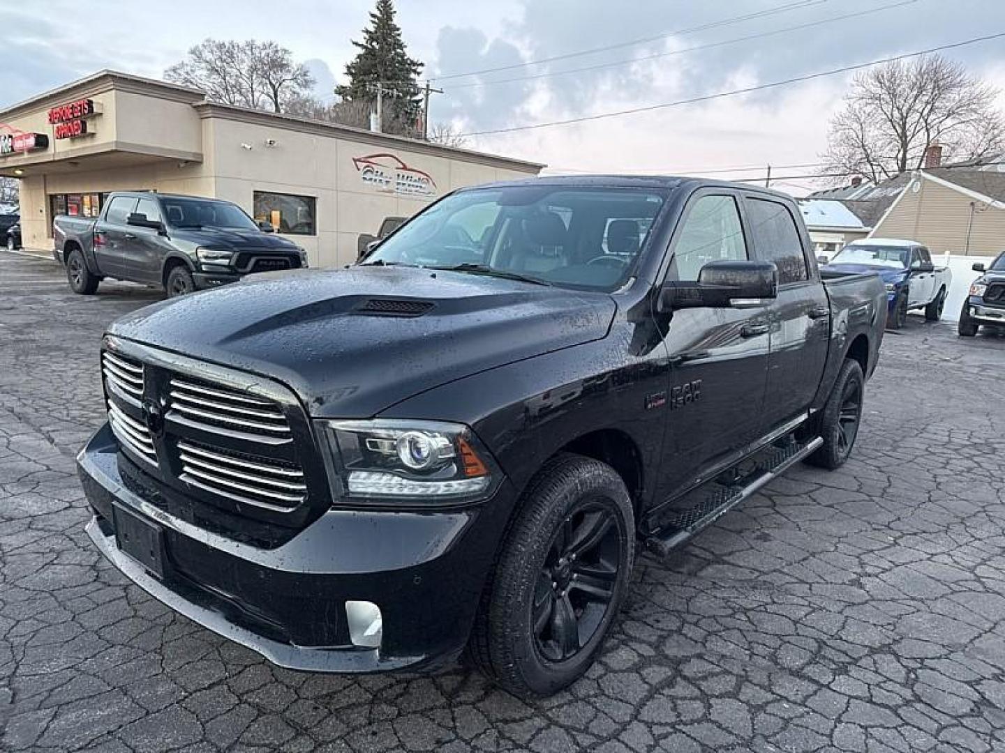 2017 BLACK /BLACK RAM 1500 Sport Crew Cab SWB 4WD (1C6RR7MT9HS) with an 5.7L V8 OHV 16V engine, 8A transmission, located at 3304 Woodville Road, Northwood, OH, 43619, (419) 210-8019, 41.612694, -83.480743 - Photo#0