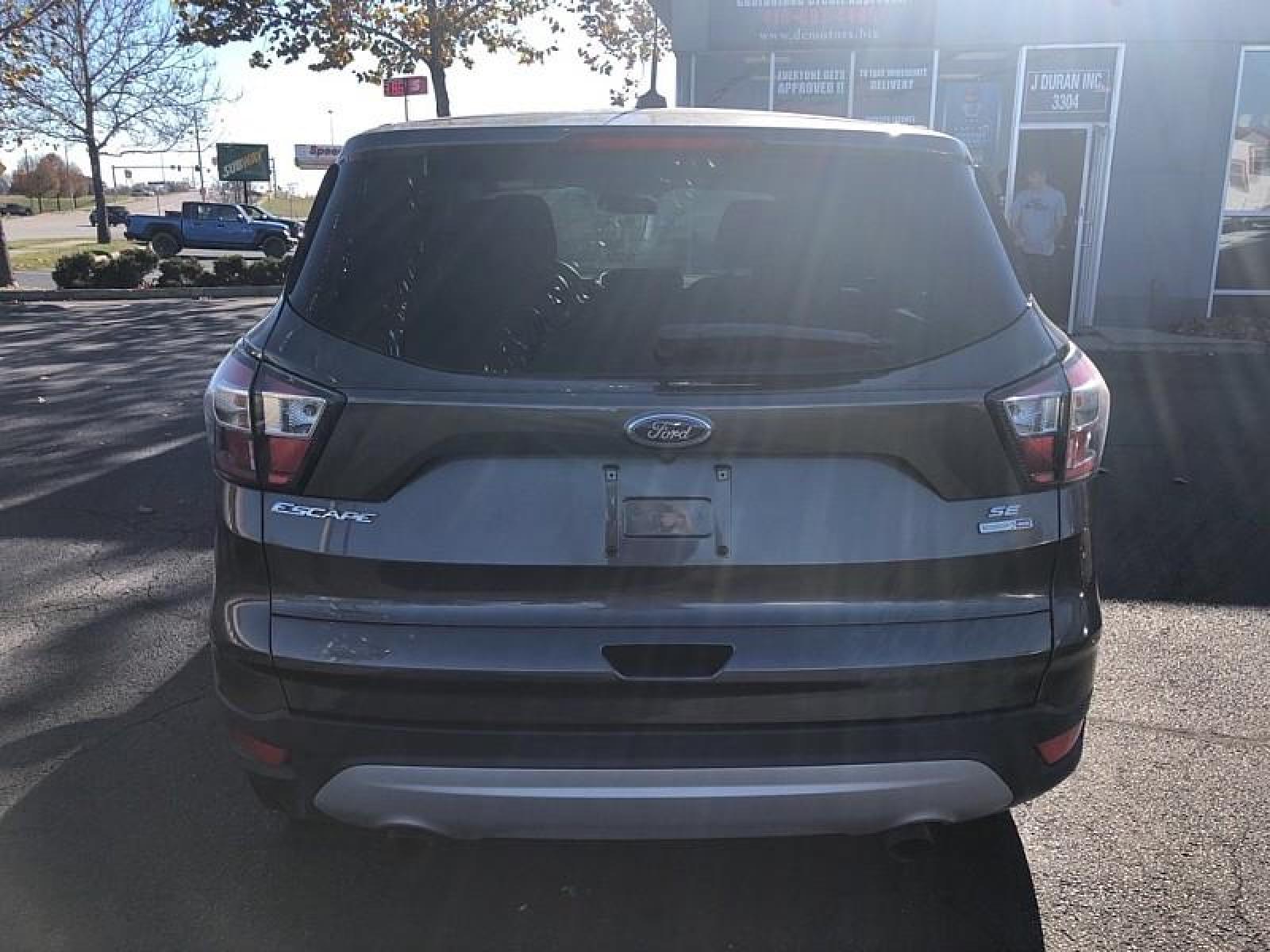 2017 GREY Ford Escape (1FMCU9G93HU) with an 4-Cyl EcoBoost 2.0T engine, Auto 6-Spd w/SelShft transmission, located at 3304 Woodville Road, Northwood, OH, 43619, (419) 210-8019, 41.612694, -83.480743 - We are #1 Auto Loan for Good Bad or No Credit we have hundreds of vehicles to chose from stop on in or just fill out our online application to get approved for auto financing and see your credit score for free by visiting our website today. We have Low Payment Options and Terms Available to Suit Y - Photo #5