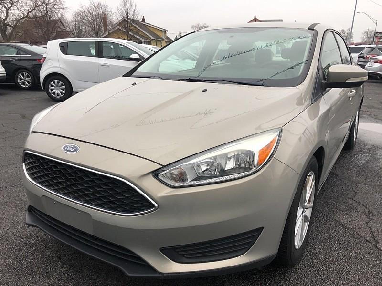 2015 GREY Ford Focus (1FADP3F25FL) with an 4-Cyl Flex Fuel 2.0L engine, Auto 6-Spd Powershift transmission, located at 3304 Woodville Road, Northwood, OH, 43619, (419) 210-8019, 41.612694, -83.480743 - We are #1 Auto Loan for Good Bad or No Credit we have hundreds of vehicles to chose from stop on in or just fill out our online application to get approved for auto financing and see your credit score for free by visiting our website today. We have Low Payment Options and Terms Available to Suit Y - Photo #0