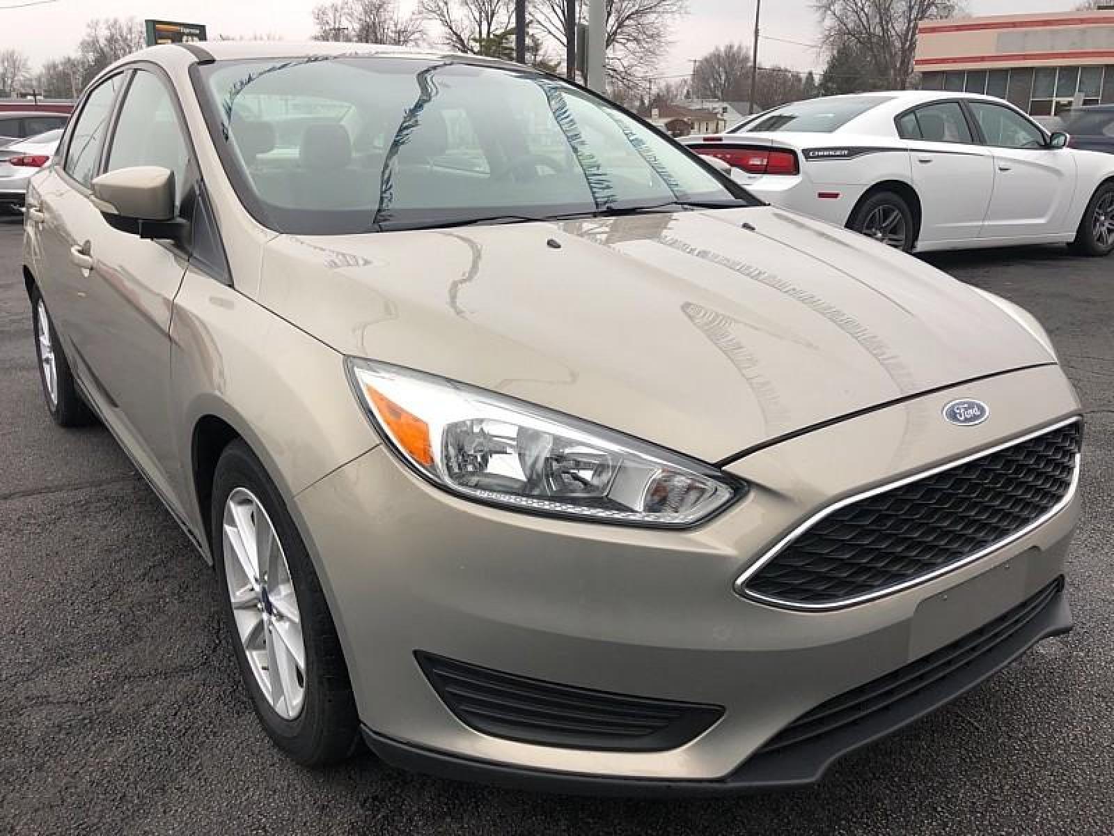 2015 GREY Ford Focus (1FADP3F25FL) with an 4-Cyl Flex Fuel 2.0L engine, Auto 6-Spd Powershift transmission, located at 3304 Woodville Road, Northwood, OH, 43619, (419) 210-8019, 41.612694, -83.480743 - We are #1 Auto Loan for Good Bad or No Credit we have hundreds of vehicles to chose from stop on in or just fill out our online application to get approved for auto financing and see your credit score for free by visiting our website today. We have Low Payment Options and Terms Available to Suit Y - Photo #2