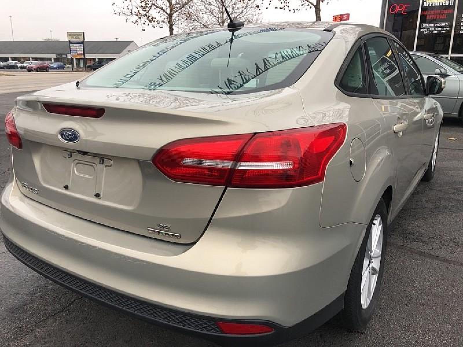2015 GREY Ford Focus (1FADP3F25FL) with an 4-Cyl Flex Fuel 2.0L engine, Auto 6-Spd Powershift transmission, located at 3304 Woodville Road, Northwood, OH, 43619, (419) 210-8019, 41.612694, -83.480743 - We are #1 Auto Loan for Good Bad or No Credit we have hundreds of vehicles to chose from stop on in or just fill out our online application to get approved for auto financing and see your credit score for free by visiting our website today. We have Low Payment Options and Terms Available to Suit Y - Photo #4