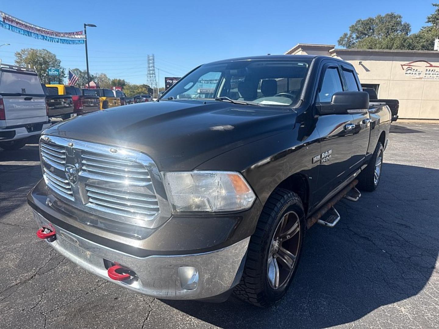 2013 BROWN /GRAY RAM 1500 SLT Quad Cab 4WD (1C6RR7GT9DS) with an 5.7L V8 OHV 16V engine, 6-Speed Automatic transmission, located at 3304 Woodville Road, Northwood, OH, 43619, (419) 210-8019, 41.612694, -83.480743 - Your #1 Destination for Auto Loans and mdash;No Matter Your Credit!At our dealership, we believe everyone deserves the opportunity to drive their dream car and mdash;whether you have good credit, bad credit, or no credit at all. With a wide selection of hundreds of cars, trucks, and SUVs, you'll fin- Photo#0