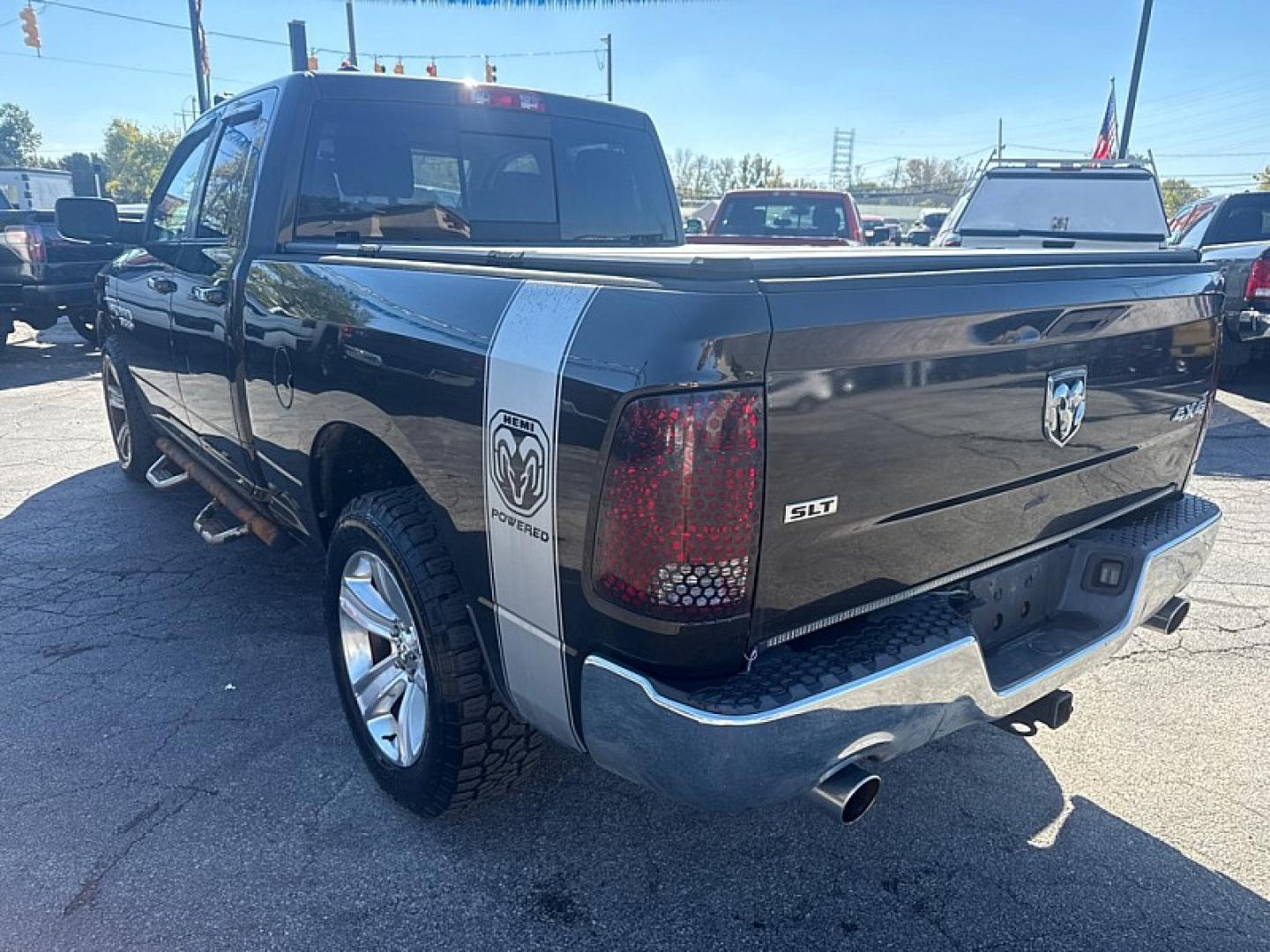 2013 BROWN /GRAY RAM 1500 SLT Quad Cab 4WD (1C6RR7GT9DS) with an 5.7L V8 OHV 16V engine, 6-Speed Automatic transmission, located at 3304 Woodville Road, Northwood, OH, 43619, (419) 210-8019, 41.612694, -83.480743 - Your #1 Destination for Auto Loans and mdash;No Matter Your Credit!At our dealership, we believe everyone deserves the opportunity to drive their dream car and mdash;whether you have good credit, bad credit, or no credit at all. With a wide selection of hundreds of cars, trucks, and SUVs, you'll fin- Photo#2