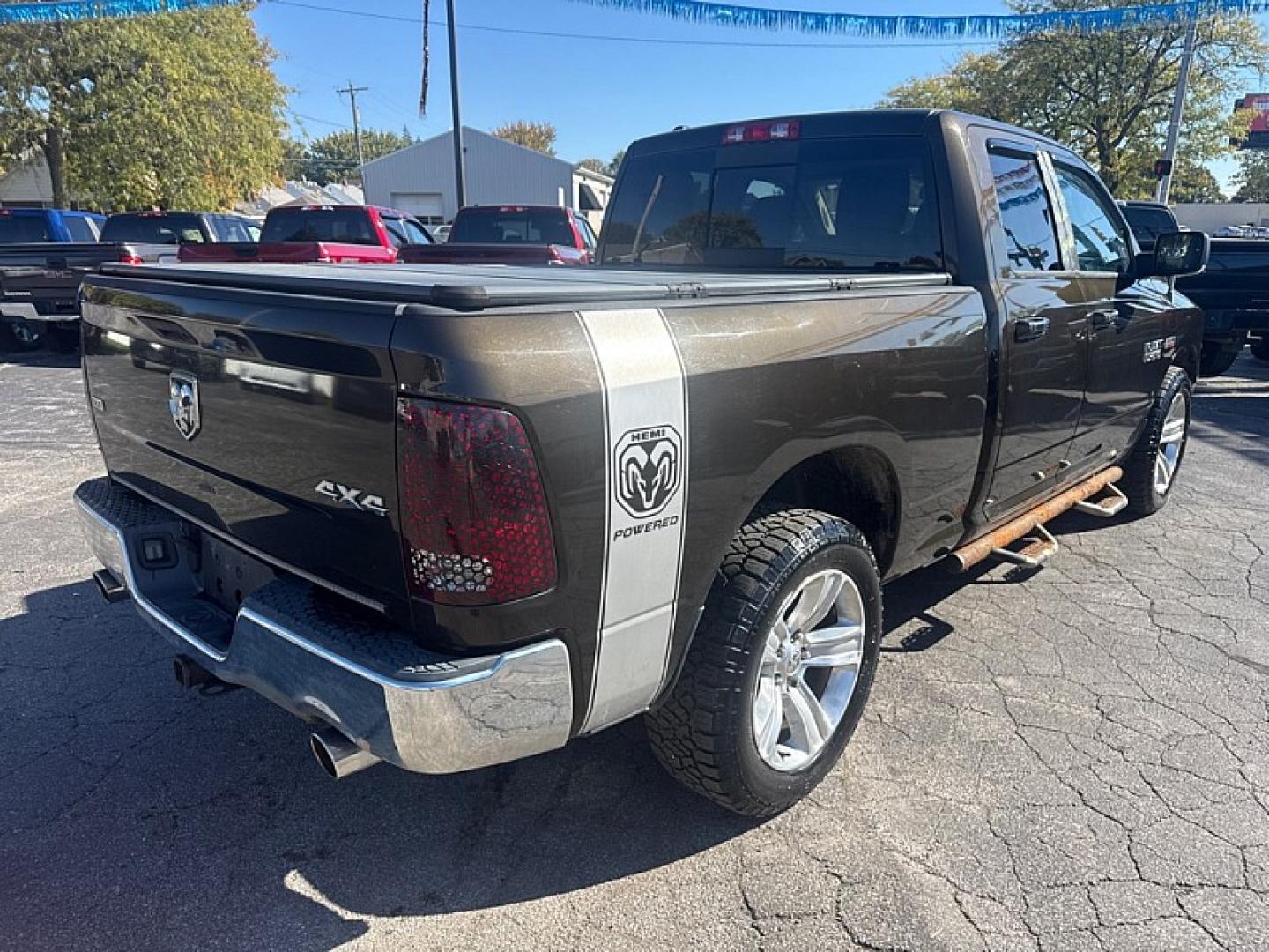 2013 BROWN /GRAY RAM 1500 SLT Quad Cab 4WD (1C6RR7GT9DS) with an 5.7L V8 OHV 16V engine, 6-Speed Automatic transmission, located at 3304 Woodville Road, Northwood, OH, 43619, (419) 210-8019, 41.612694, -83.480743 - Your #1 Destination for Auto Loans and mdash;No Matter Your Credit!At our dealership, we believe everyone deserves the opportunity to drive their dream car and mdash;whether you have good credit, bad credit, or no credit at all. With a wide selection of hundreds of cars, trucks, and SUVs, you'll fin- Photo#4