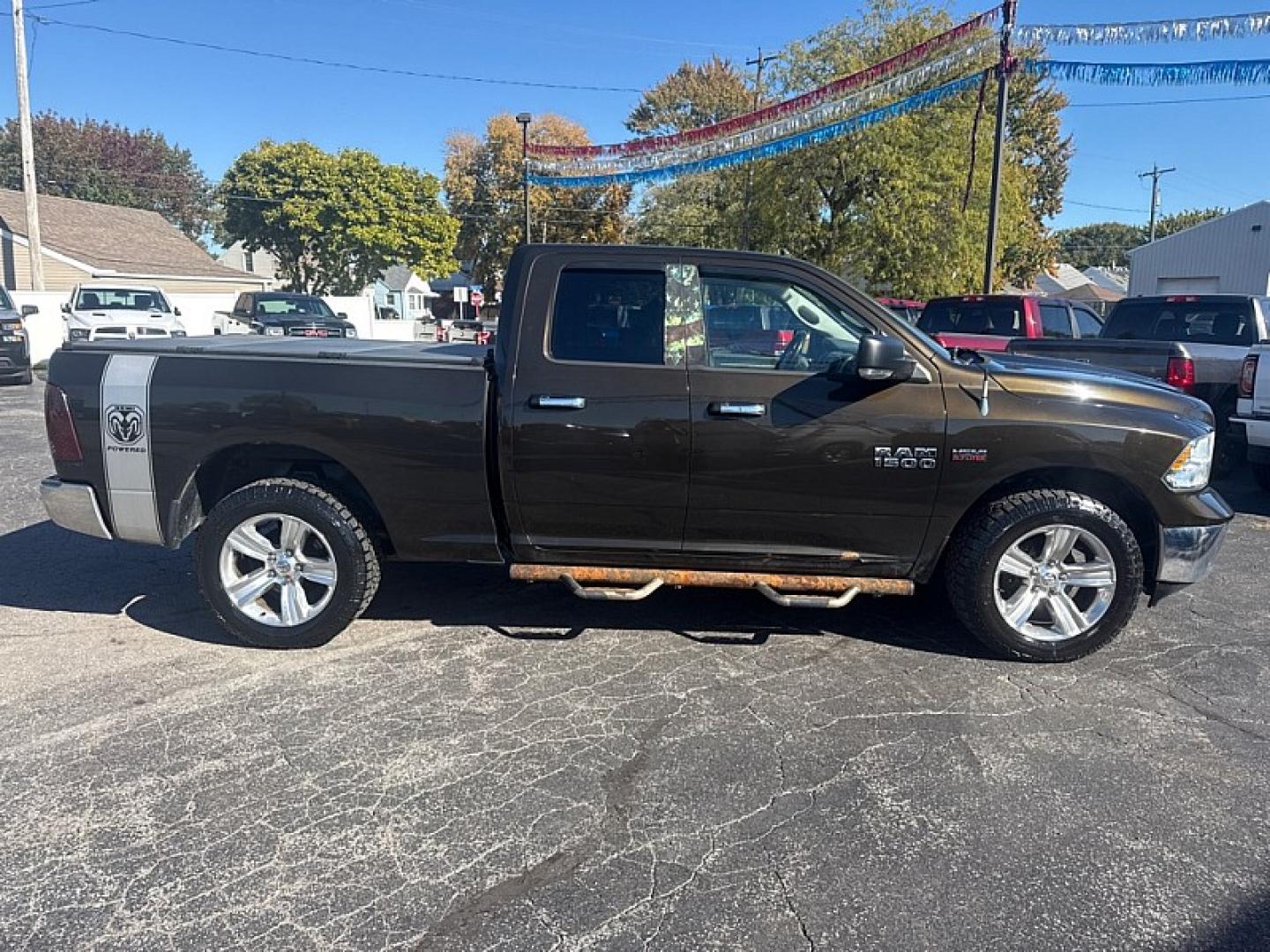 2013 BROWN /GRAY RAM 1500 SLT Quad Cab 4WD (1C6RR7GT9DS) with an 5.7L V8 OHV 16V engine, 6-Speed Automatic transmission, located at 3304 Woodville Road, Northwood, OH, 43619, (419) 210-8019, 41.612694, -83.480743 - Your #1 Destination for Auto Loans and mdash;No Matter Your Credit!At our dealership, we believe everyone deserves the opportunity to drive their dream car and mdash;whether you have good credit, bad credit, or no credit at all. With a wide selection of hundreds of cars, trucks, and SUVs, you'll fin- Photo#5