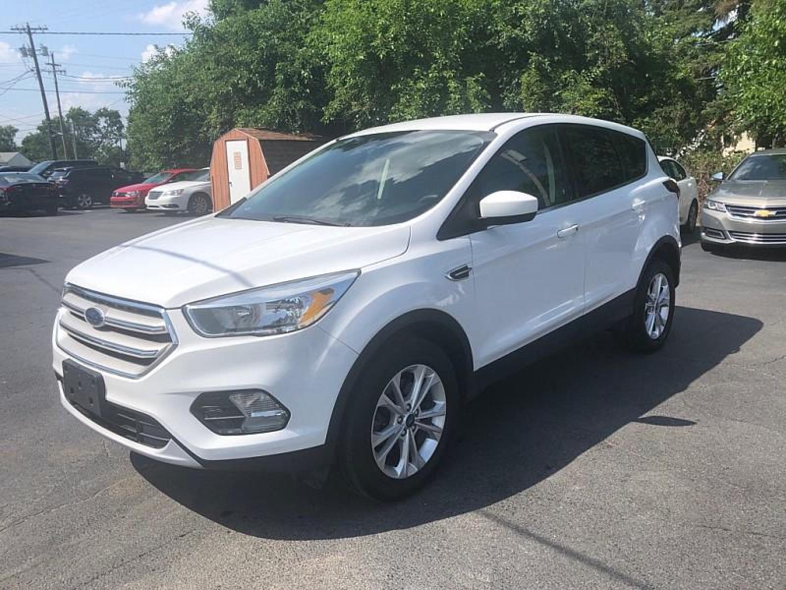 2019 WHITE /BLACK Ford Escape (1FMCU9GD1KU) with an 4-Cyl 1.5 Liter engine, Automatic transmission, located at 3304 Woodville Road, Northwood, OH, 43619, (419) 210-8019, 41.612694, -83.480743 - We are #1 Auto Loan for Good Bad or No Credit we have hundreds of vehicles to choose from stop on in or just fill out our online application to get approved for auto financing and see your credit score for free by visiting our website today. We have Low Payment Options and Terms Available to Suit - Photo #0