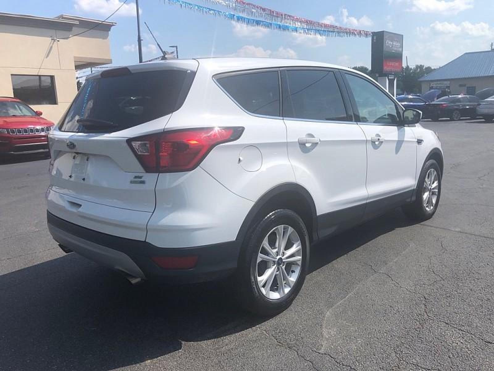 2019 WHITE /BLACK Ford Escape (1FMCU9GD1KU) with an 4-Cyl 1.5 Liter engine, Automatic transmission, located at 3304 Woodville Road, Northwood, OH, 43619, (419) 210-8019, 41.612694, -83.480743 - We are #1 Auto Loan for Good Bad or No Credit we have hundreds of vehicles to choose from stop on in or just fill out our online application to get approved for auto financing and see your credit score for free by visiting our website today. We have Low Payment Options and Terms Available to Suit - Photo #5