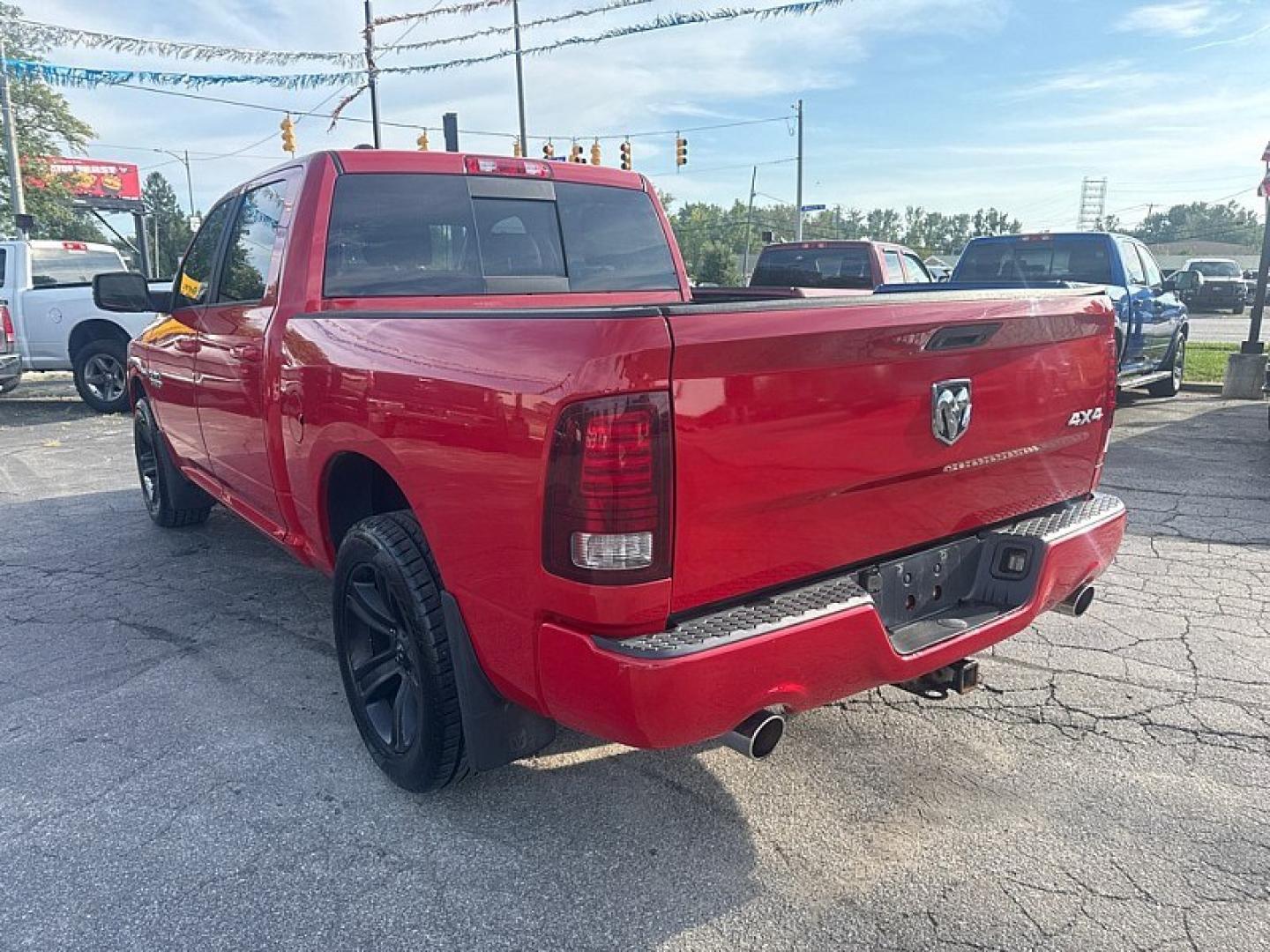 2015 RED /BLACK RAM 1500 Sport Crew Cab SWB 4WD (1C6RR7MT9FS) with an 5.7L V8 OHV 16V engine, 6-Speed Automatic transmission, located at 3304 Woodville Road, Northwood, OH, 43619, (419) 210-8019, 41.612694, -83.480743 - Your #1 Destination for Auto Loans and mdash;No Matter Your Credit!At our dealership, we believe everyone deserves the opportunity to drive their dream car and mdash;whether you have good credit, bad credit, or no credit at all. With a wide selection of hundreds of cars, trucks, and SUVs, you'll fin- Photo#2