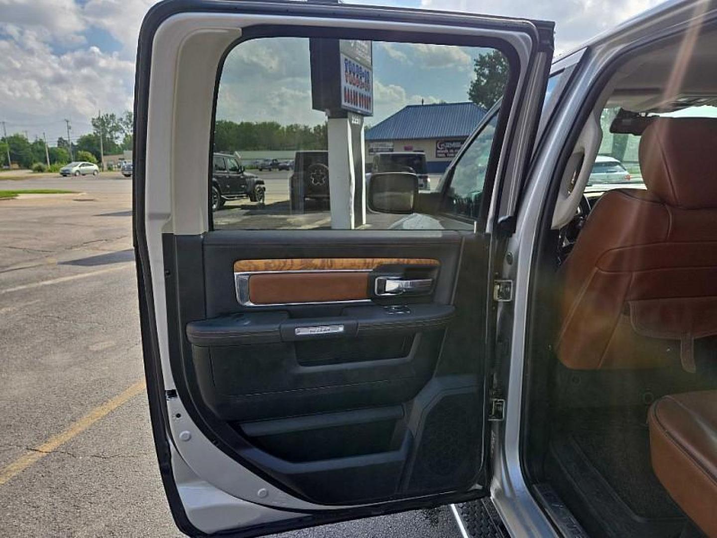 2014 SILVER /BROWN RAM 1500 Laramie Longhorn Edition Crew Cab LWB 4WD (1C6RR7WTXES) with an 5.7L V8 OHV 16V engine, 6-Speed Automatic transmission, located at 3304 Woodville Road, Northwood, OH, 43619, (419) 210-8019, 41.612694, -83.480743 - Your #1 Destination for Auto Loans and mdash;No Matter Your Credit!At our dealership, we believe everyone deserves the opportunity to drive their dream car and mdash;whether you have good credit, bad credit, or no credit at all. With a wide selection of hundreds of cars, trucks, and SUVs, you'll fin - Photo#10
