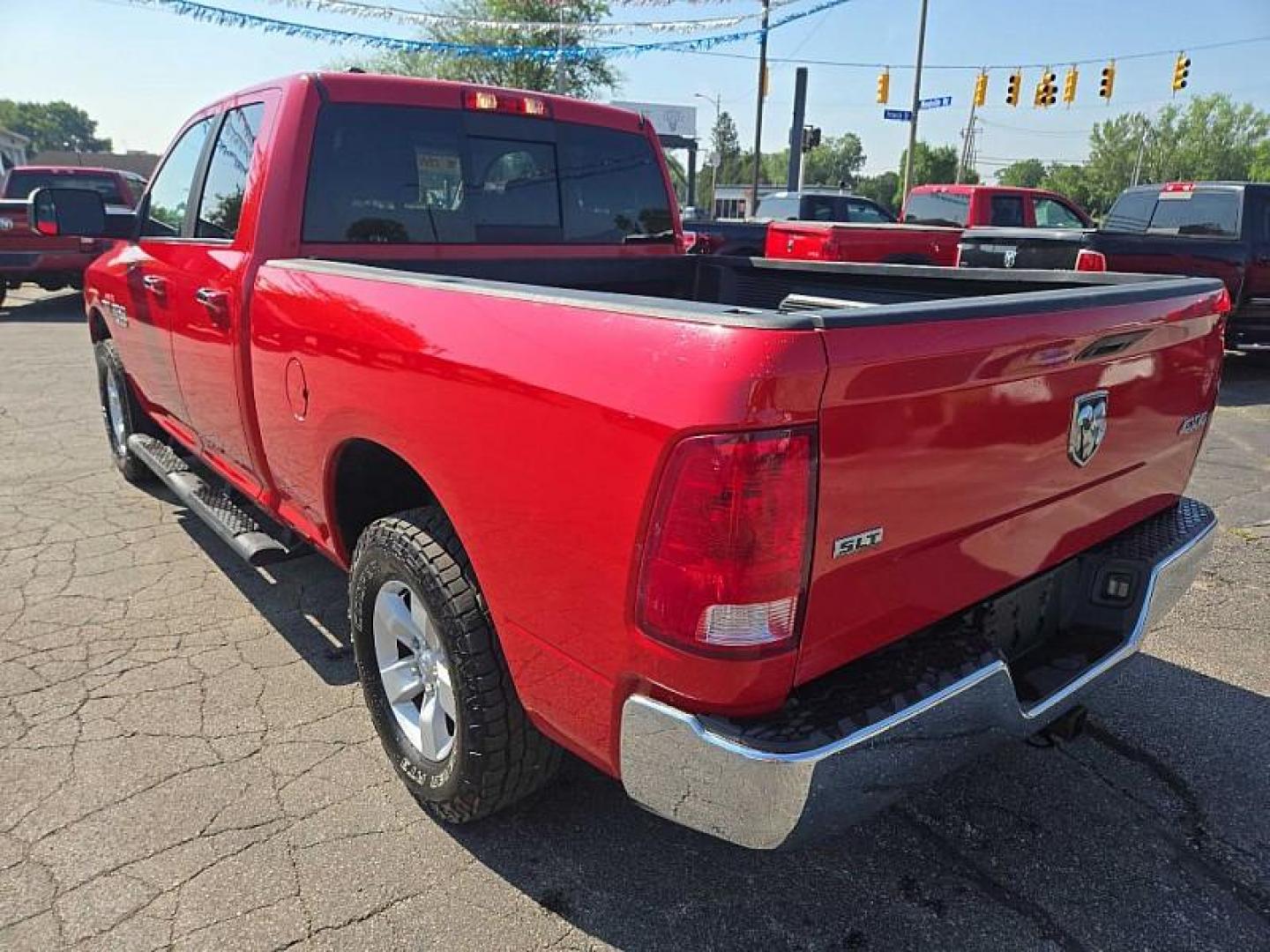 2016 RED /BLACK RAM 1500 SLT Quad Cab 4WD (1C6RR7GT4GS) with an 5.7L V8 OHV 16V engine, 6A transmission, located at 3304 Woodville Road, Northwood, OH, 43619, (419) 210-8019, 41.612694, -83.480743 - Photo#2