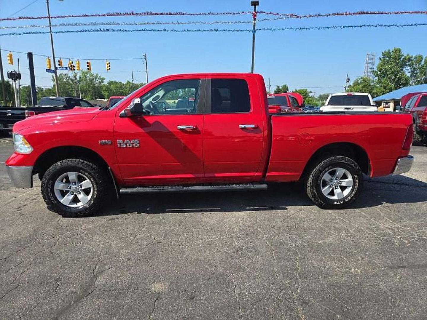 2016 RED /BLACK RAM 1500 SLT Quad Cab 4WD (1C6RR7GT4GS) with an 5.7L V8 OHV 16V engine, 6A transmission, located at 3304 Woodville Road, Northwood, OH, 43619, (419) 210-8019, 41.612694, -83.480743 - Photo#1