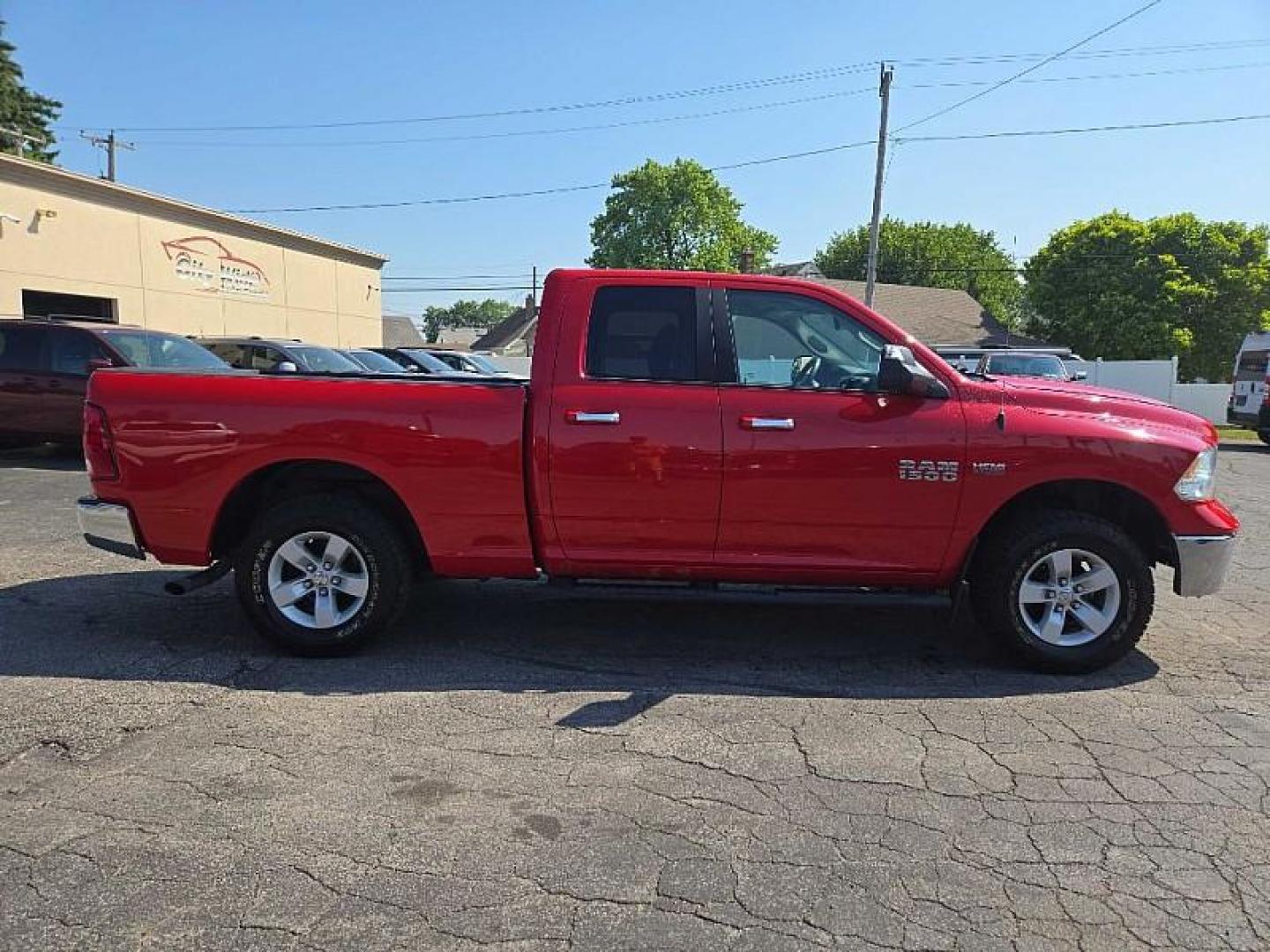 2016 RED /BLACK RAM 1500 SLT Quad Cab 4WD (1C6RR7GT4GS) with an 5.7L V8 OHV 16V engine, 6A transmission, located at 3304 Woodville Road, Northwood, OH, 43619, (419) 210-8019, 41.612694, -83.480743 - Photo#5
