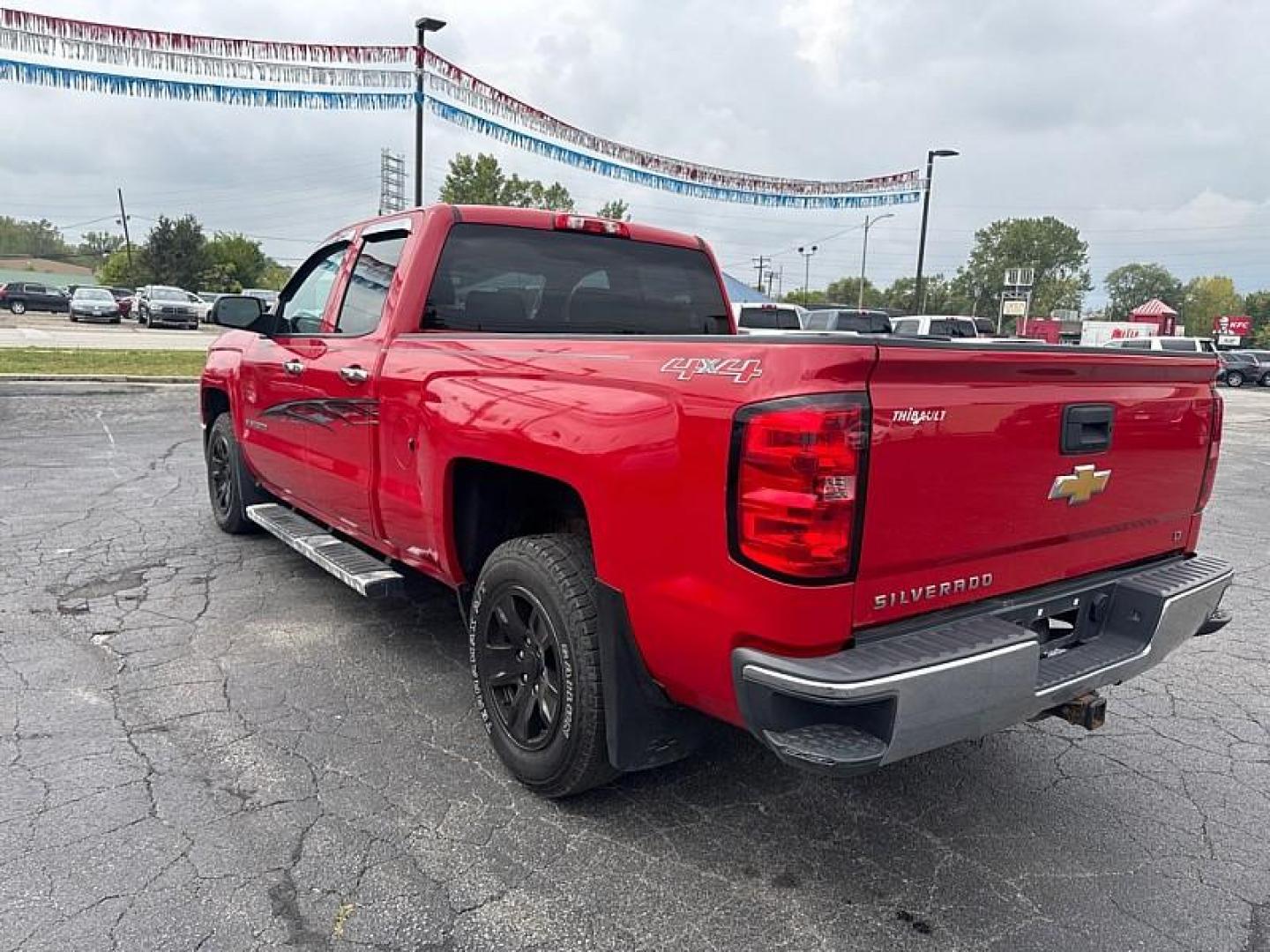 2014 RED /BLACK Chevrolet Silverado 1500 1LT Double Cab 4WD (1GCVKREC7EZ) with an 5.3L V8 OHV 16V engine, 6-Speed Automatic transmission, located at 3304 Woodville Road, Northwood, OH, 43619, (419) 210-8019, 41.612694, -83.480743 - Your #1 Destination for Auto Loans and mdash;No Matter Your Credit!At our dealership, we believe everyone deserves the opportunity to drive their dream car and mdash;whether you have good credit, bad credit, or no credit at all. With a wide selection of hundreds of cars, trucks, and SUVs, you'll fin - Photo#2